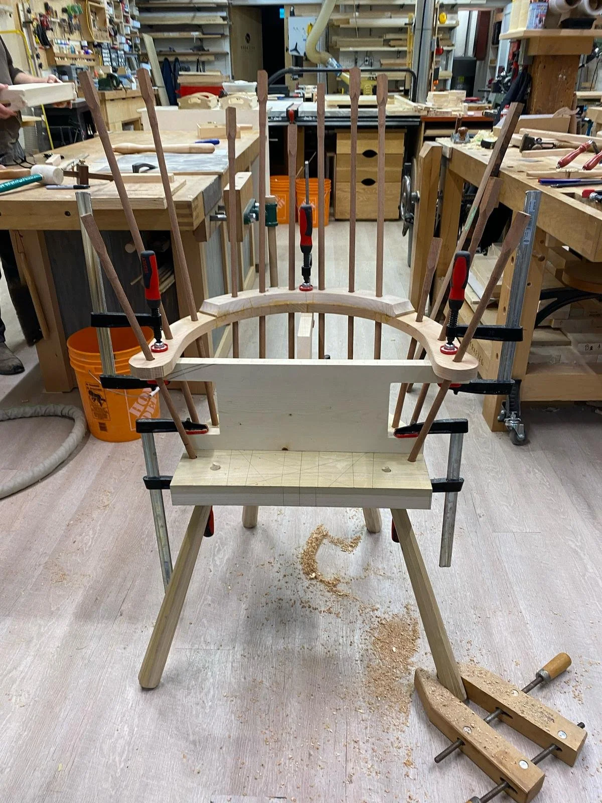 Stick chair mid-glue up with long spindles protruding