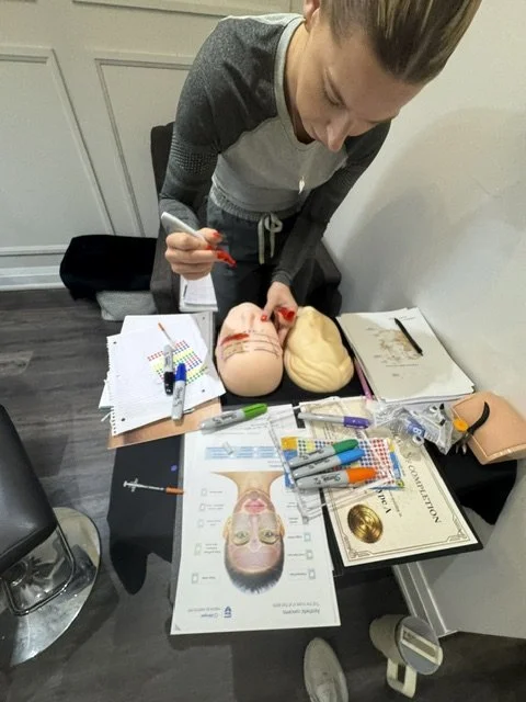 Nurse injector student practising facial landmarking and mannequin mapping during private 1:1 Botox and dermal filler training in Vaughan.