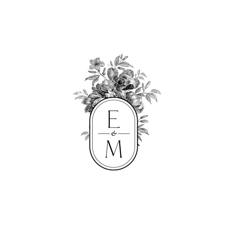 Black and white floral monogram design featuring the initials 'F & M' inside an oval frame.