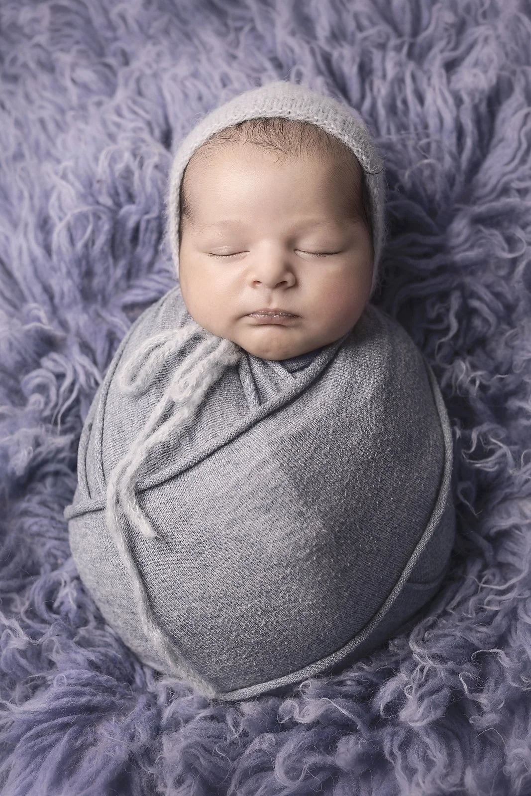 wrapped baby asleep on fur, newborn photographer, western sydney mini session