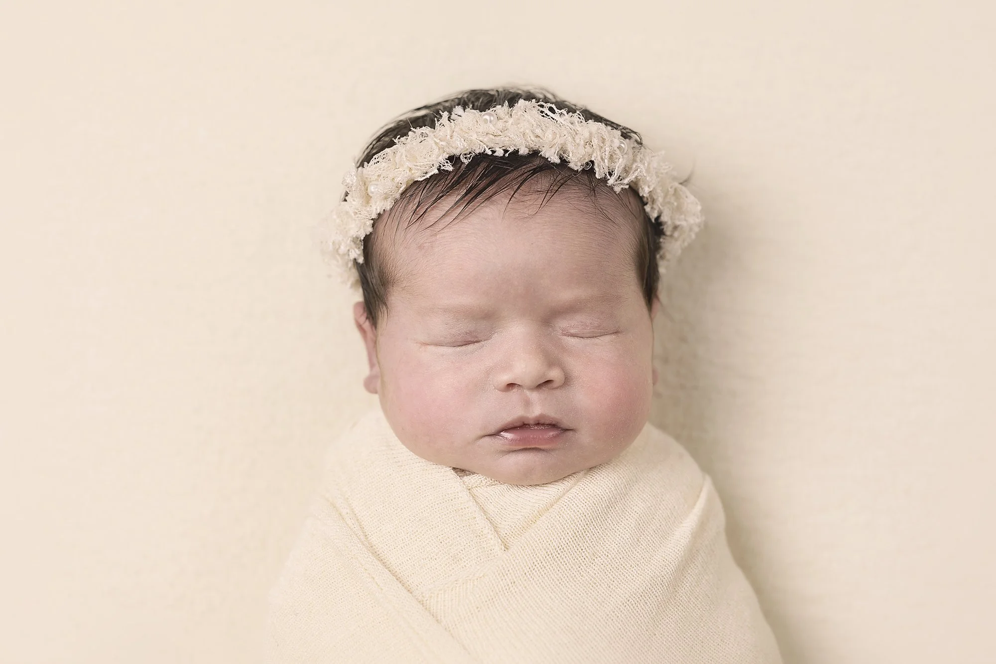 baby girl with cream halo asleep, family newborn photoshoot, hills district