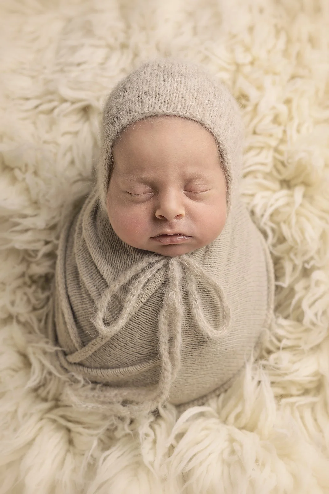 newborn baby boy photographed asleep wrapped penrith blue mountains hills district western sydney beige bonnet mini session