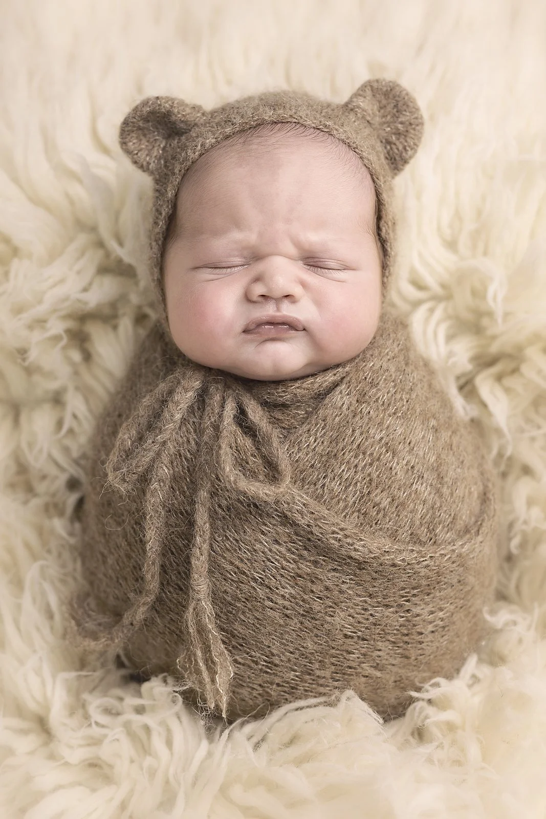 baby wrapped in brown teddy bear bonnet, newborn photoshoot, western sydney