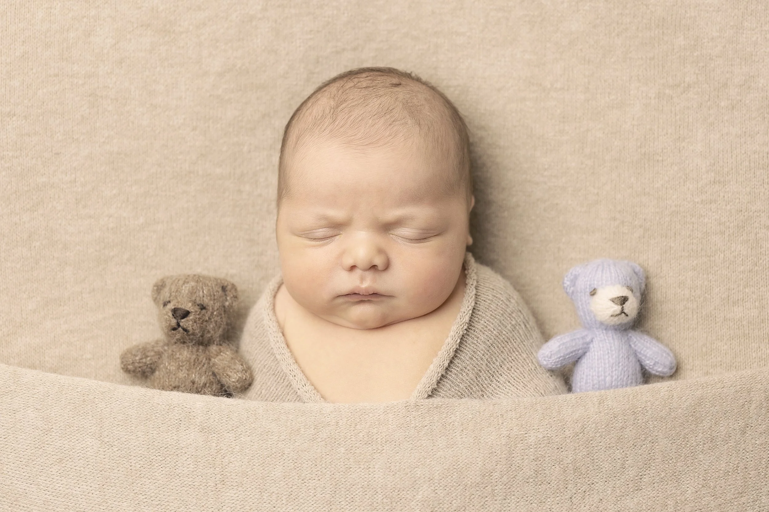 baby boy asleep with teddies wrapped mini newborn photography session penrith