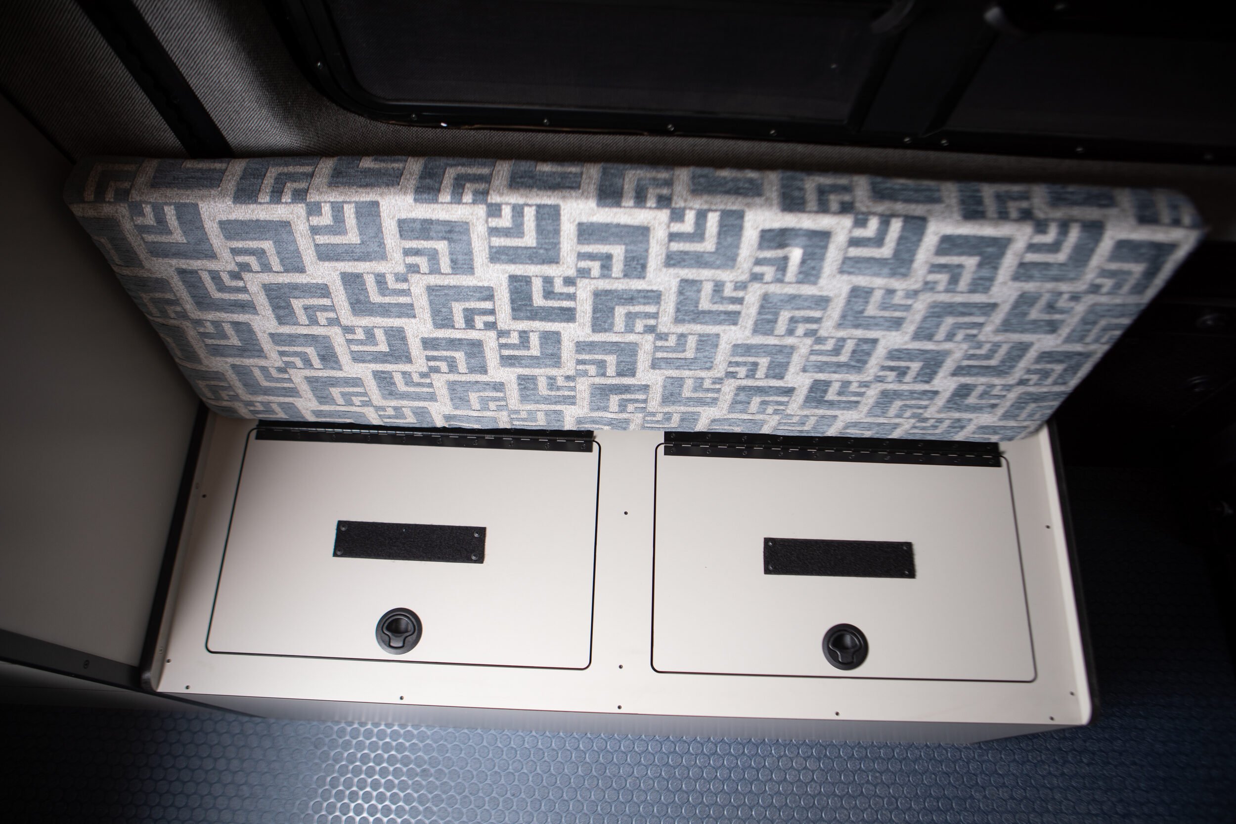 09-camper-van-bench-storage-and-toilet.jpg