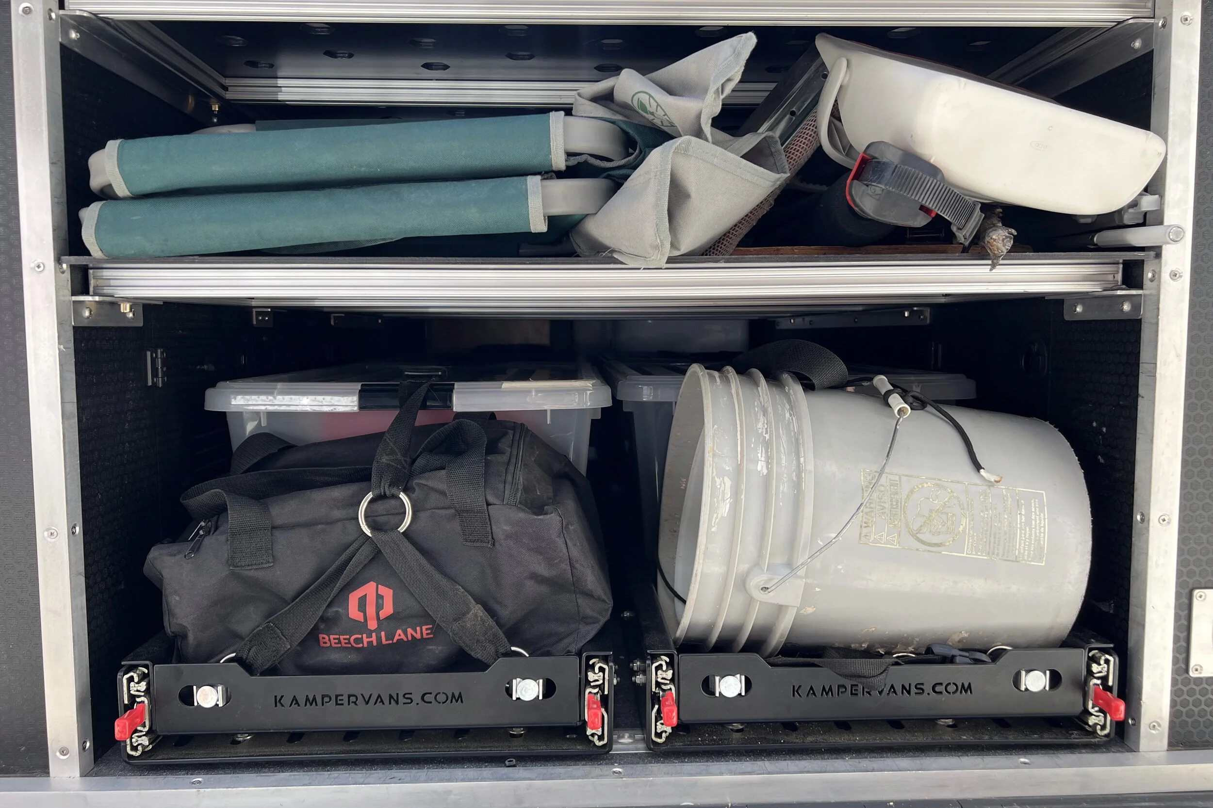 12-fishing-gear-storage-in-camper-van-garage.jpg