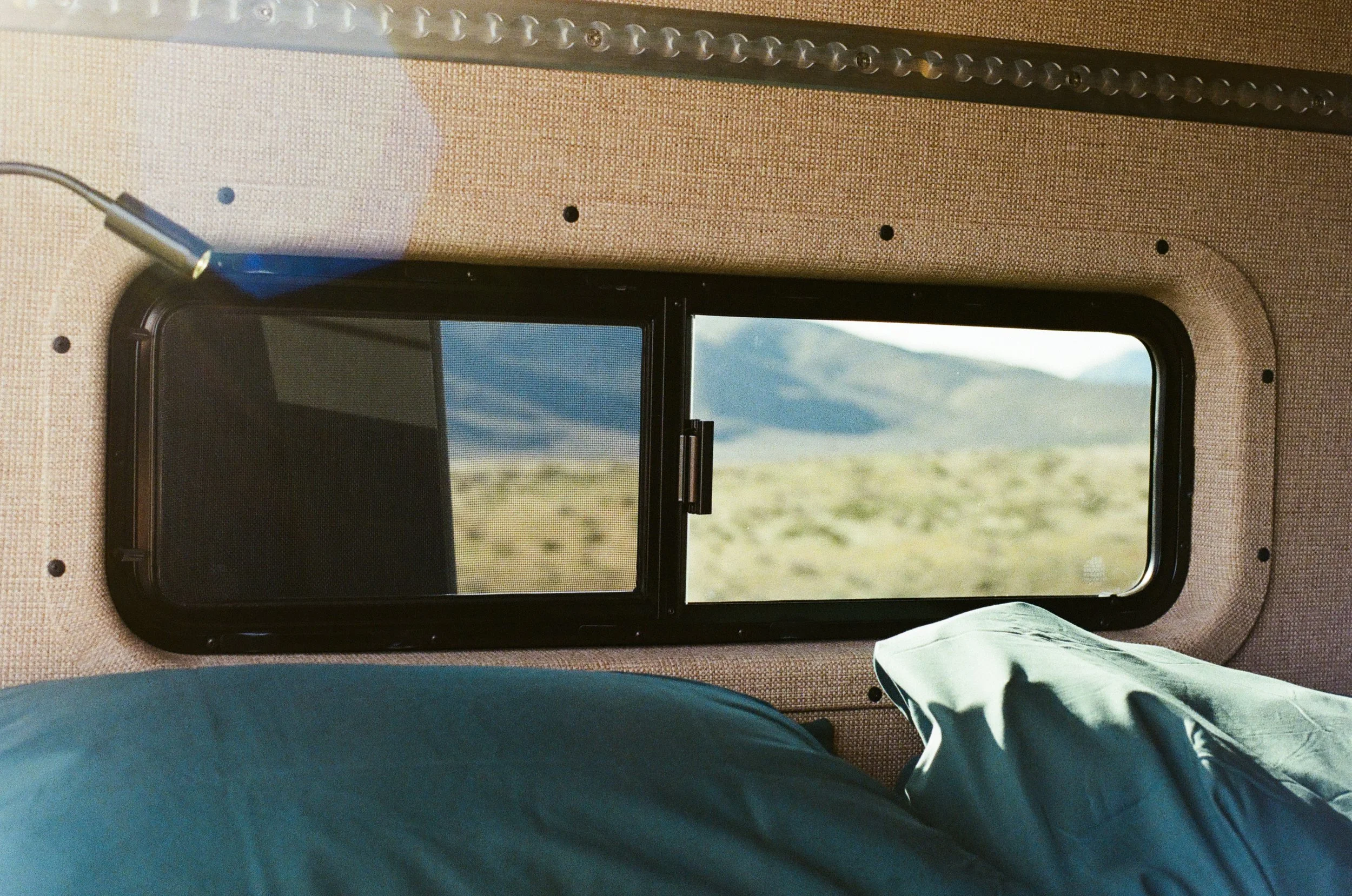 Camper Van Bed Window with Nevada Desert View.jpg