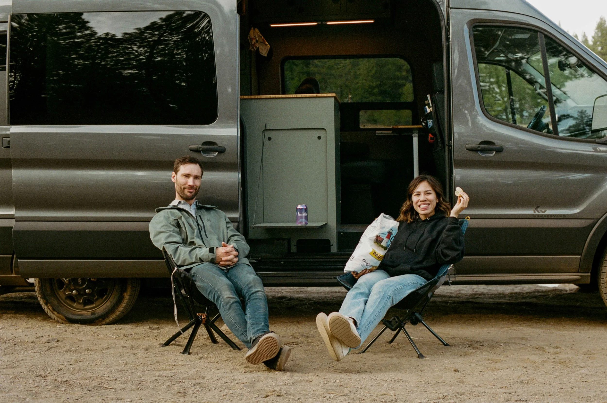kamper-vans-owners-relaxing-outside-ford-transit-build.jpg
