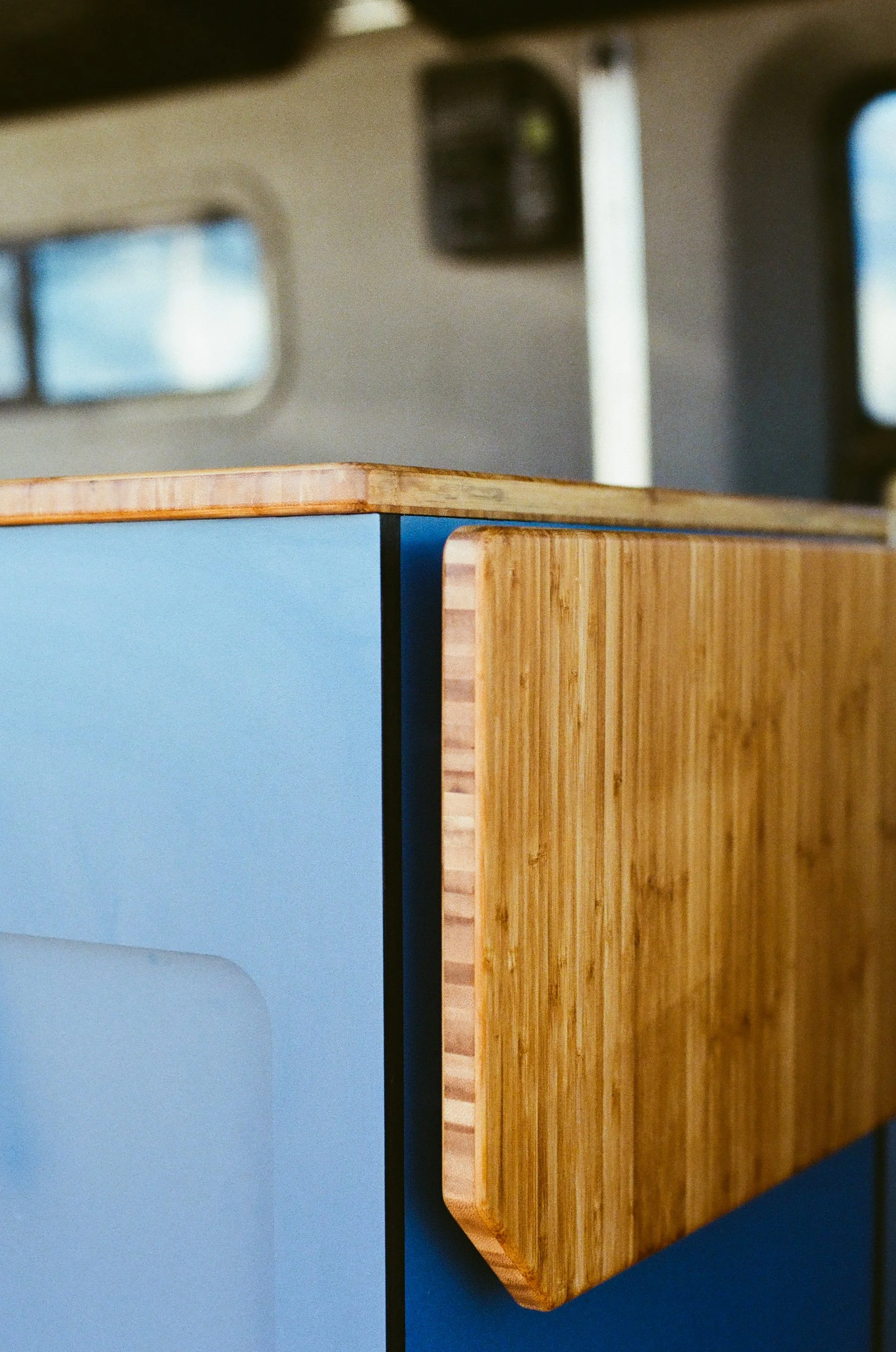 blue-camper-van-cabinetry-bamboo-countertop.jpg