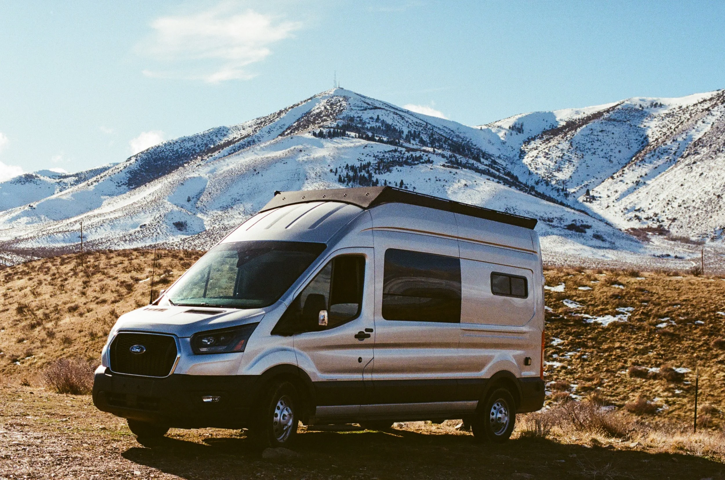 ford-transit-camper-van-snowy-mountain-campsite.jpg