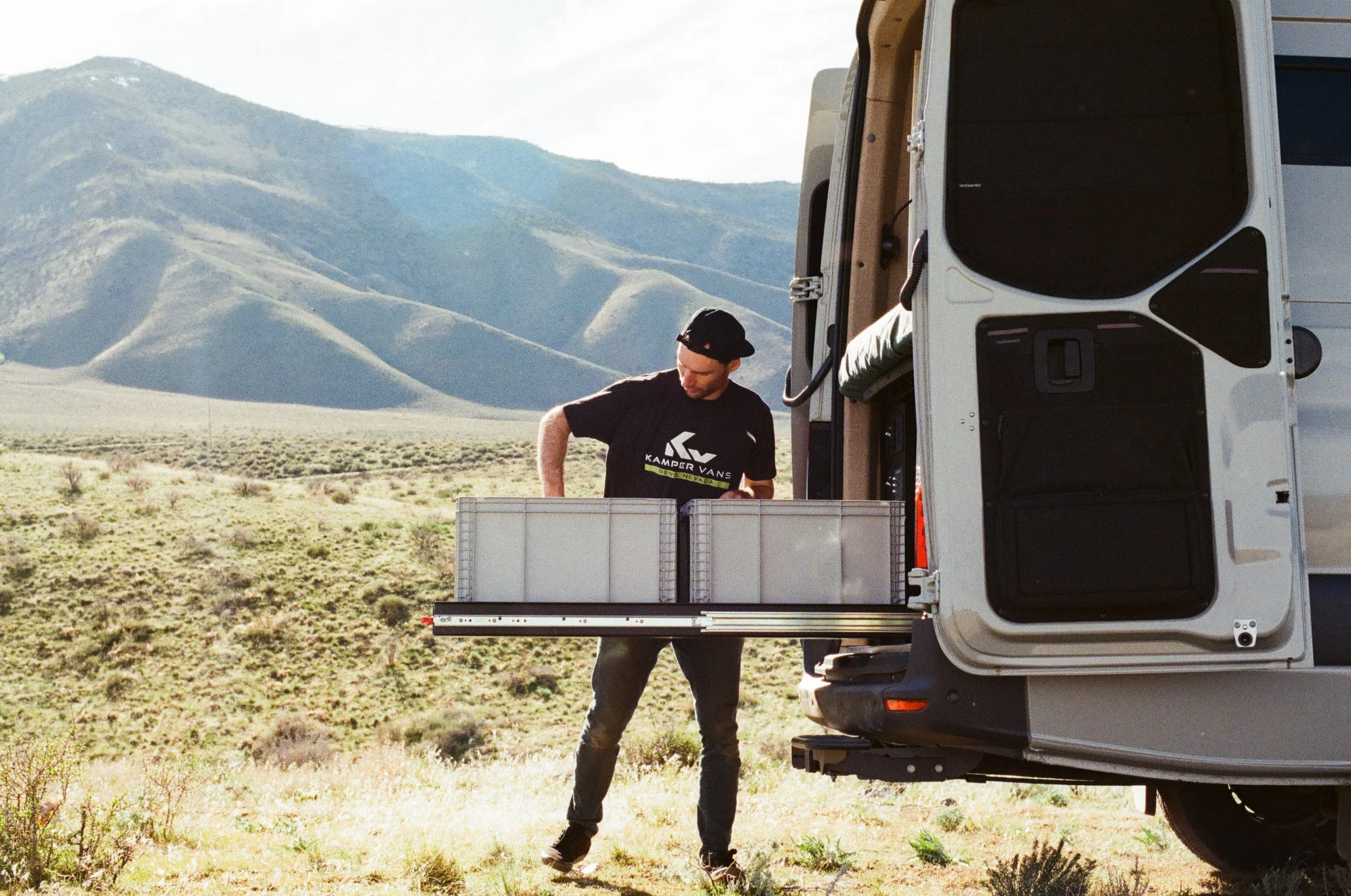 Rear Gear Storage Slide in Rugged Sprinter Camper Van.jpg