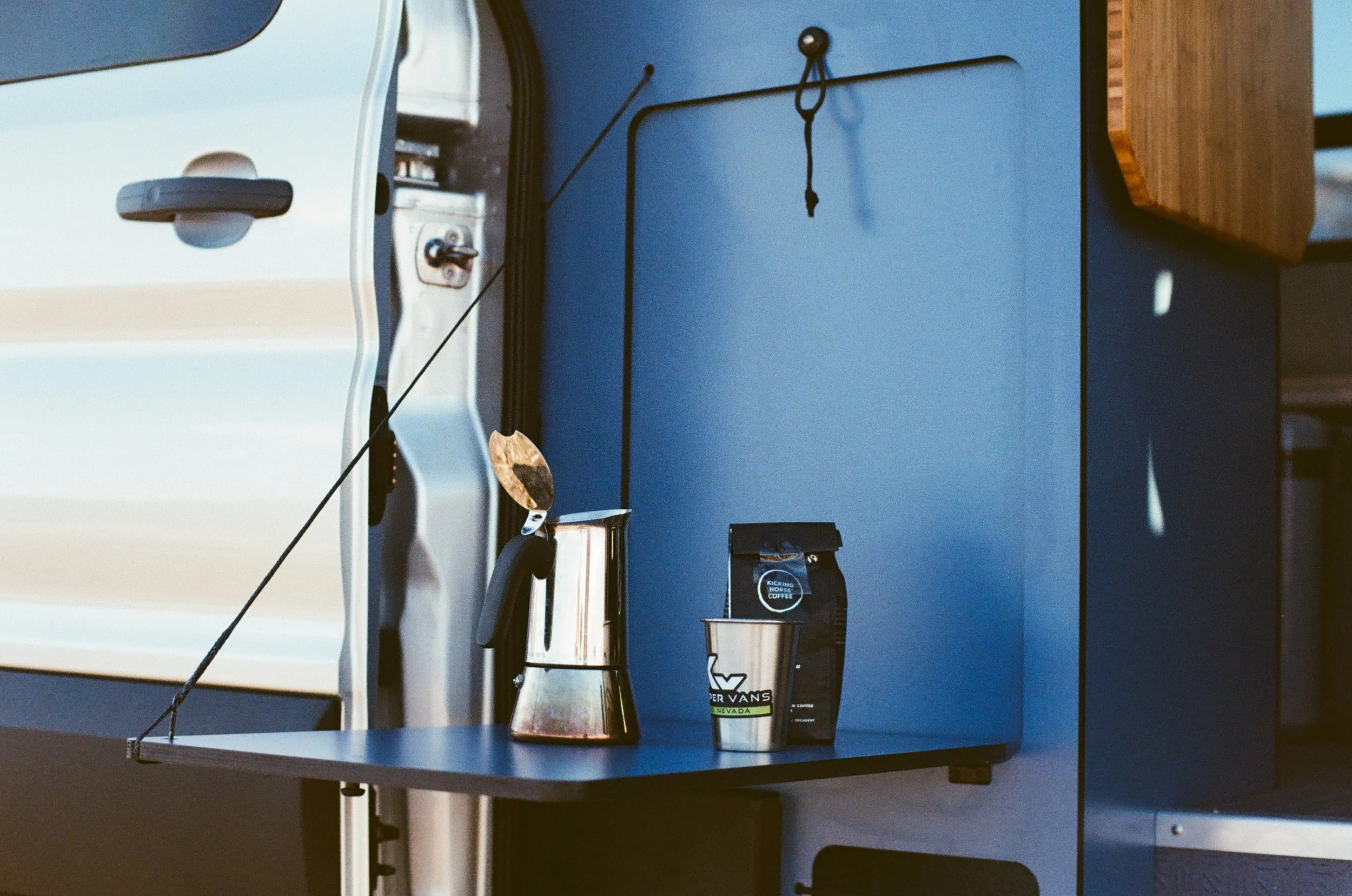 camper-van-fold-down-table-coffee-setup.jpg