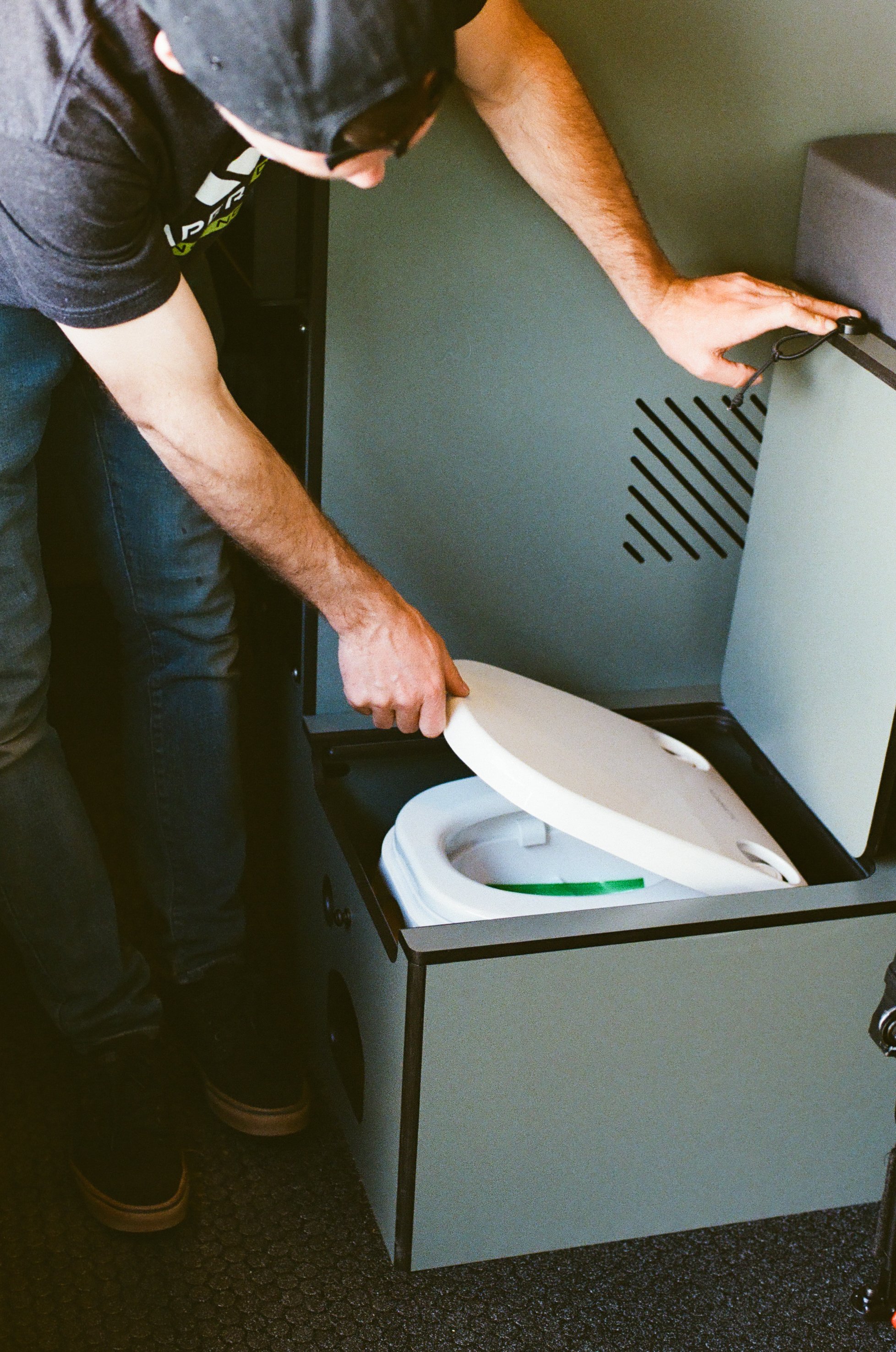 Hidden Toilet Storage in Custom Sprinter Camper Van.jpg