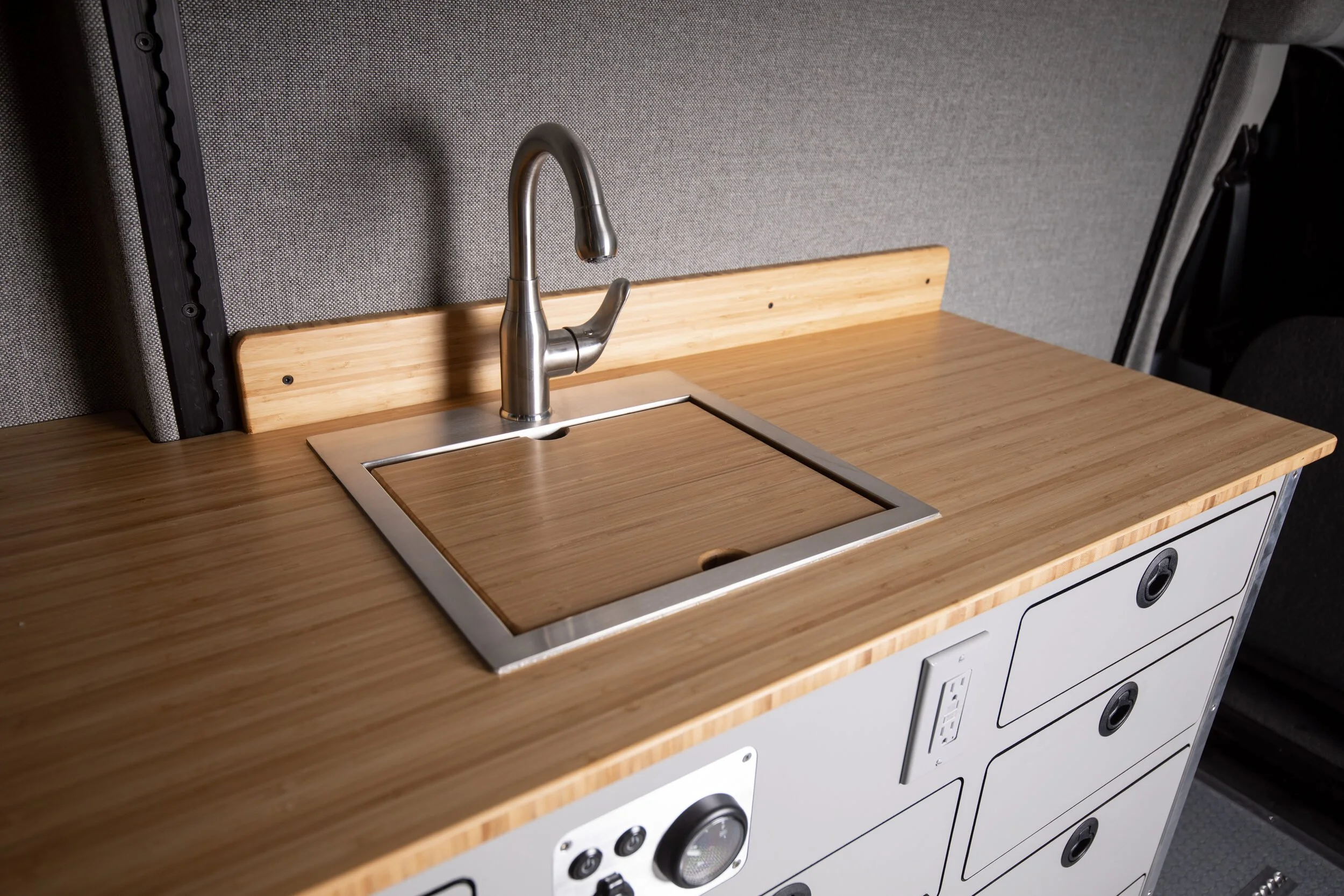 07-camper-van-bamboo-countertop-sink-and-faucet.jpg