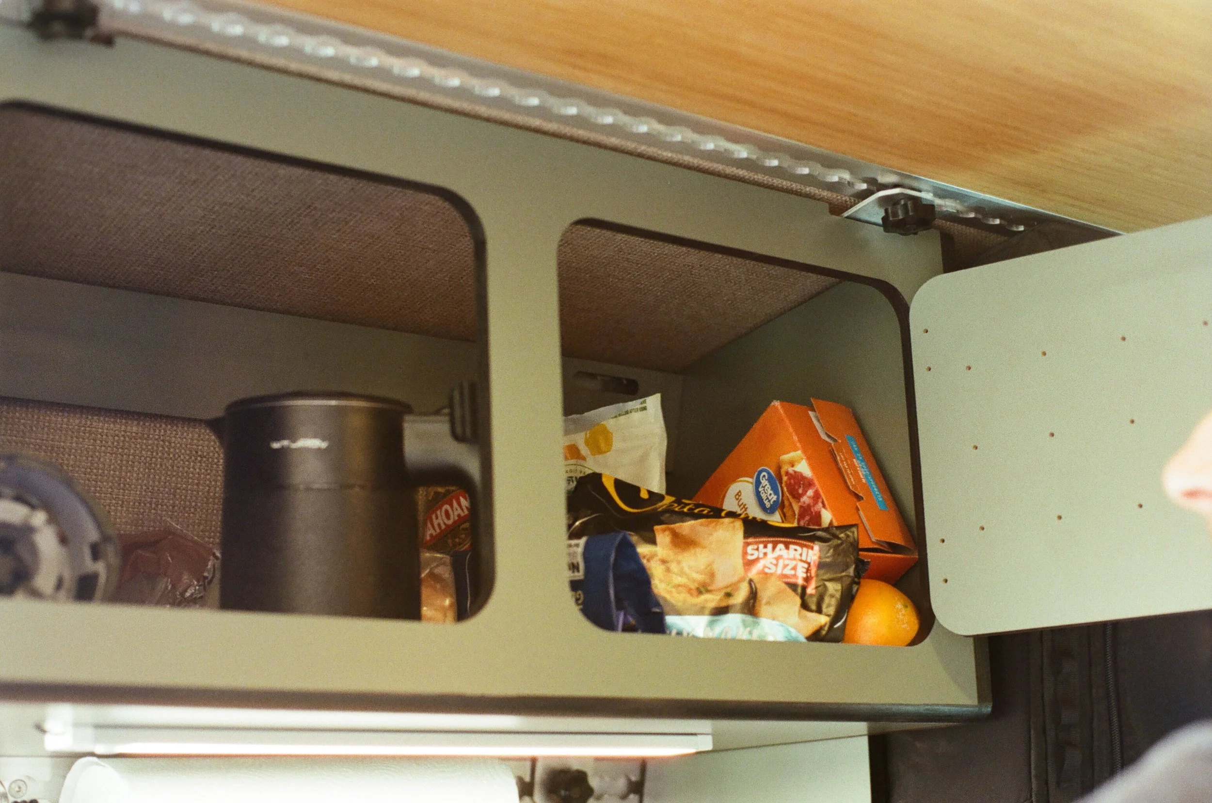 Overhead Pantry Storage in Sprinter Camper Van.jpg