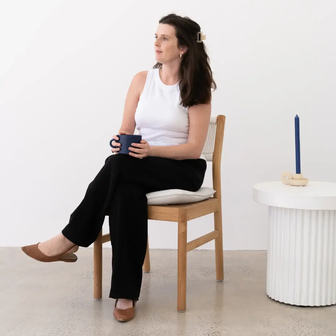 Kim Patterson naturopath Frankston sitting with tea ready for a appointment