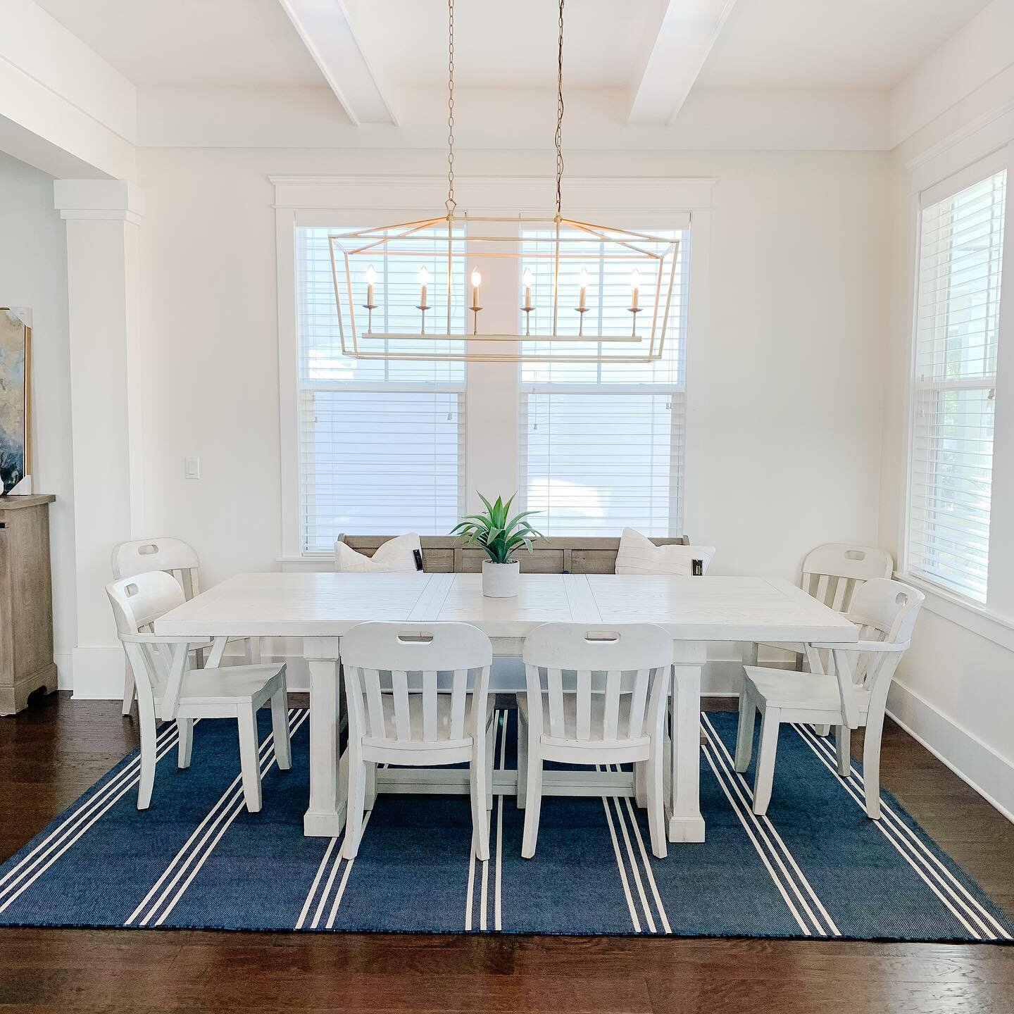 ✨BEFORE + AFTER ✨
My first 30A project from afar is almost complete! Here is the dining room space - we had all the walls go from a tan to white, new warm toned light fixture and rug and furniture to give it a beachy fresh feel! 💙 🤍💙 swipe to see 