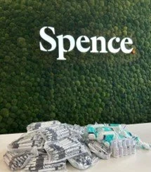 Items donated with Spence logo in the background