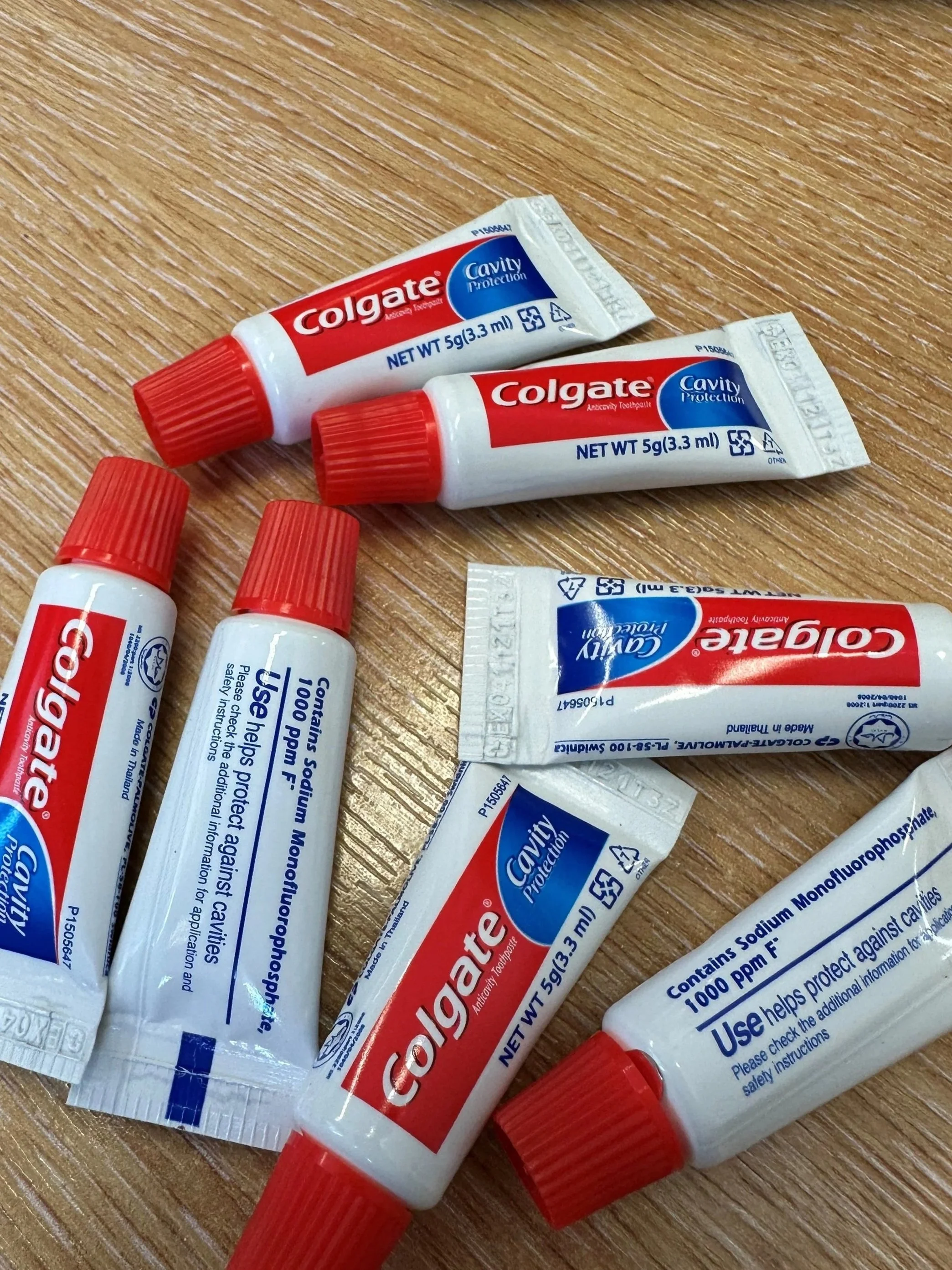 8 mini Colgate toothpastes