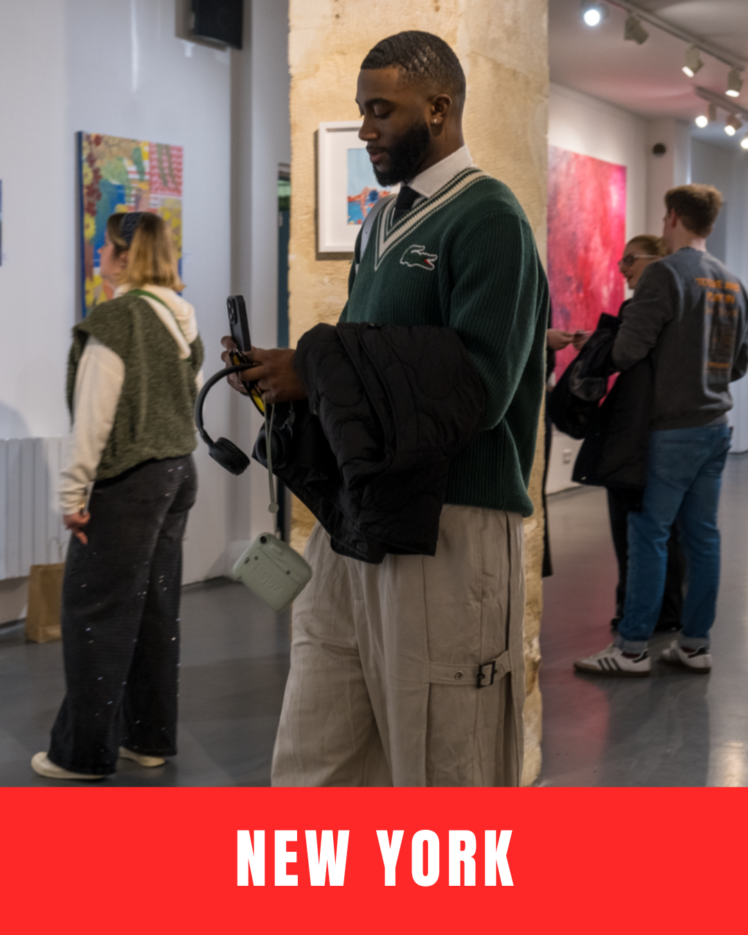 Crowd of people inside a shopping area with "New York" text overlay at the bottom.