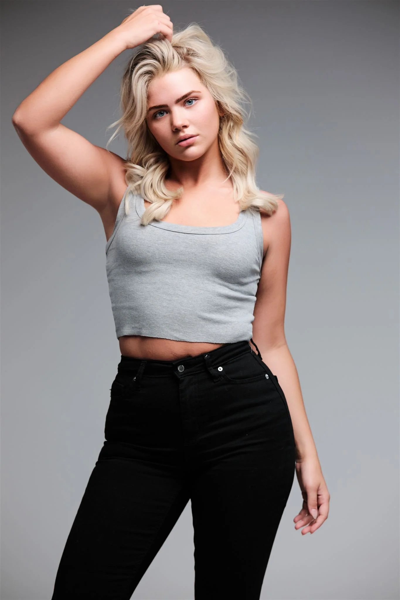 Full-body modeling portfolio image with editorial-style posing captured in downtown St. Louis