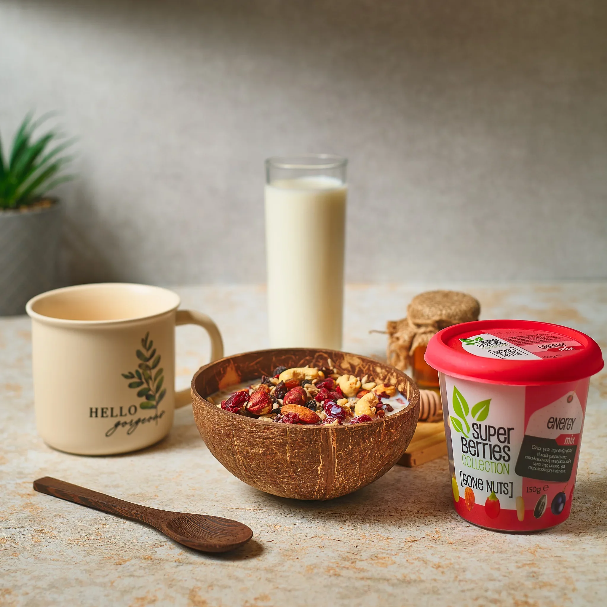Commercial food photography by Vasilis Geravelis με concept υγιεινού πρωινού για το Super Berries Energy Mix. Δημιουργικό food styling με μπολ καρύδας, γάλα, μέλι και κούπα σε γήινους τόνους.