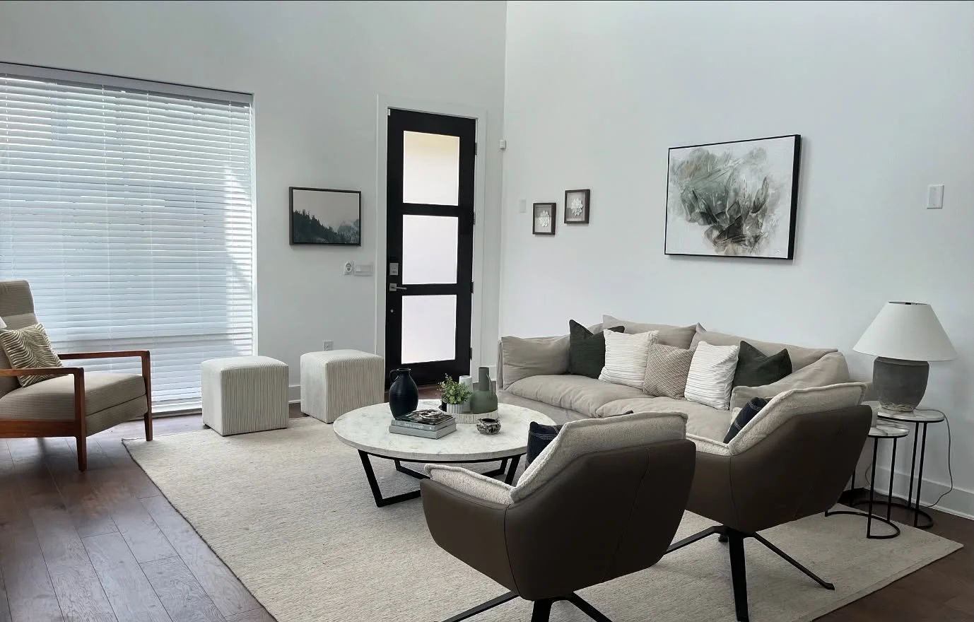 Our team was able to take this home to the next level by removing some of the bulkier furniture from the living room and adding modern artwork, accents and decor to the space. Swipe to see the before ➡️

Want to work with us? We can be reached by pho