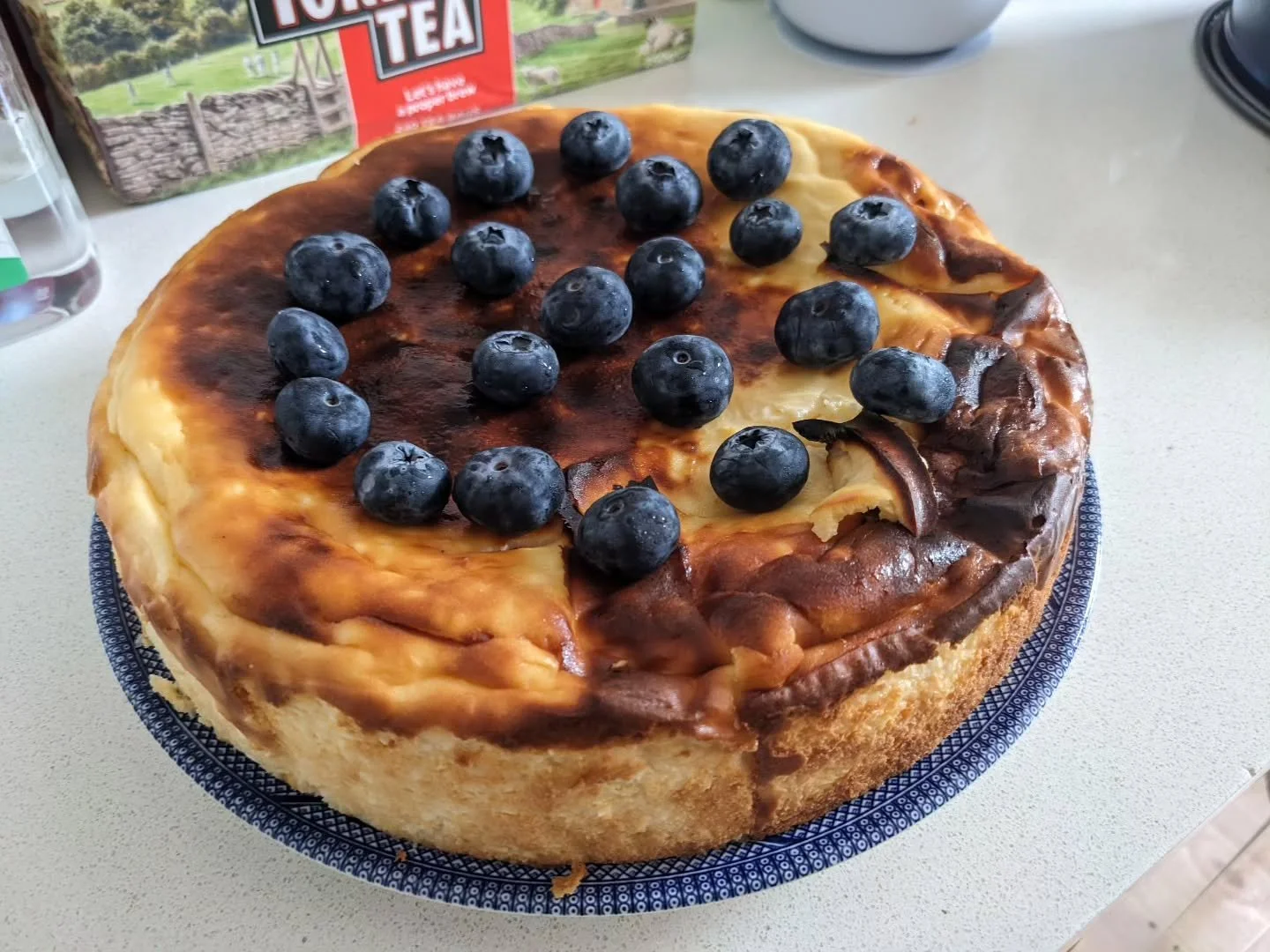 Another creative endeavour! Basque cheesecake, a new adventure without weighing scales while away! Actually worked well. A few blueberries for embellishment.  An inspiration for an artwork? 

#basquecheesecake #basquefood #cheesecake #dessertlover #f