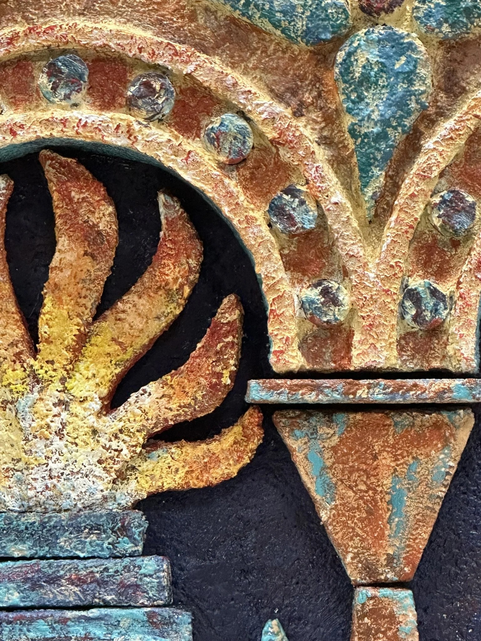 High-relief mixed-media wall sculpture featuring a central fire framed by architectural arches and geometric motifs. Inspired by Zoroastrian heritage and ancient ossuary imagerey, the work combines textured surfaces and sculptural depth.