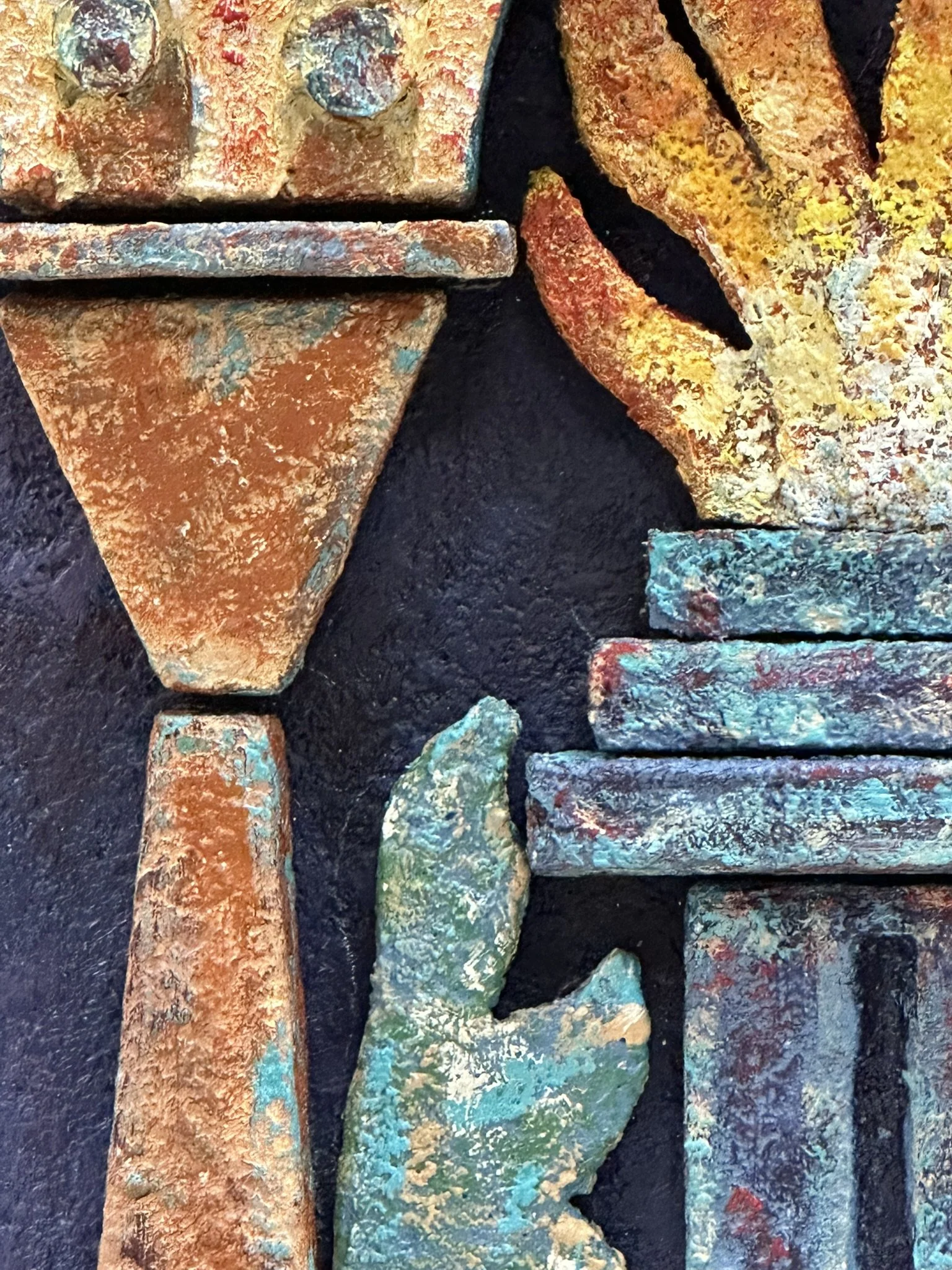 High-relief mixed-media wall sculpture featuring a central fire framed by architectural arches and geometric motifs. Inspired by Zoroastrian heritage and ancient ossuary imagerey, the work combines textured surfaces and sculptural depth.