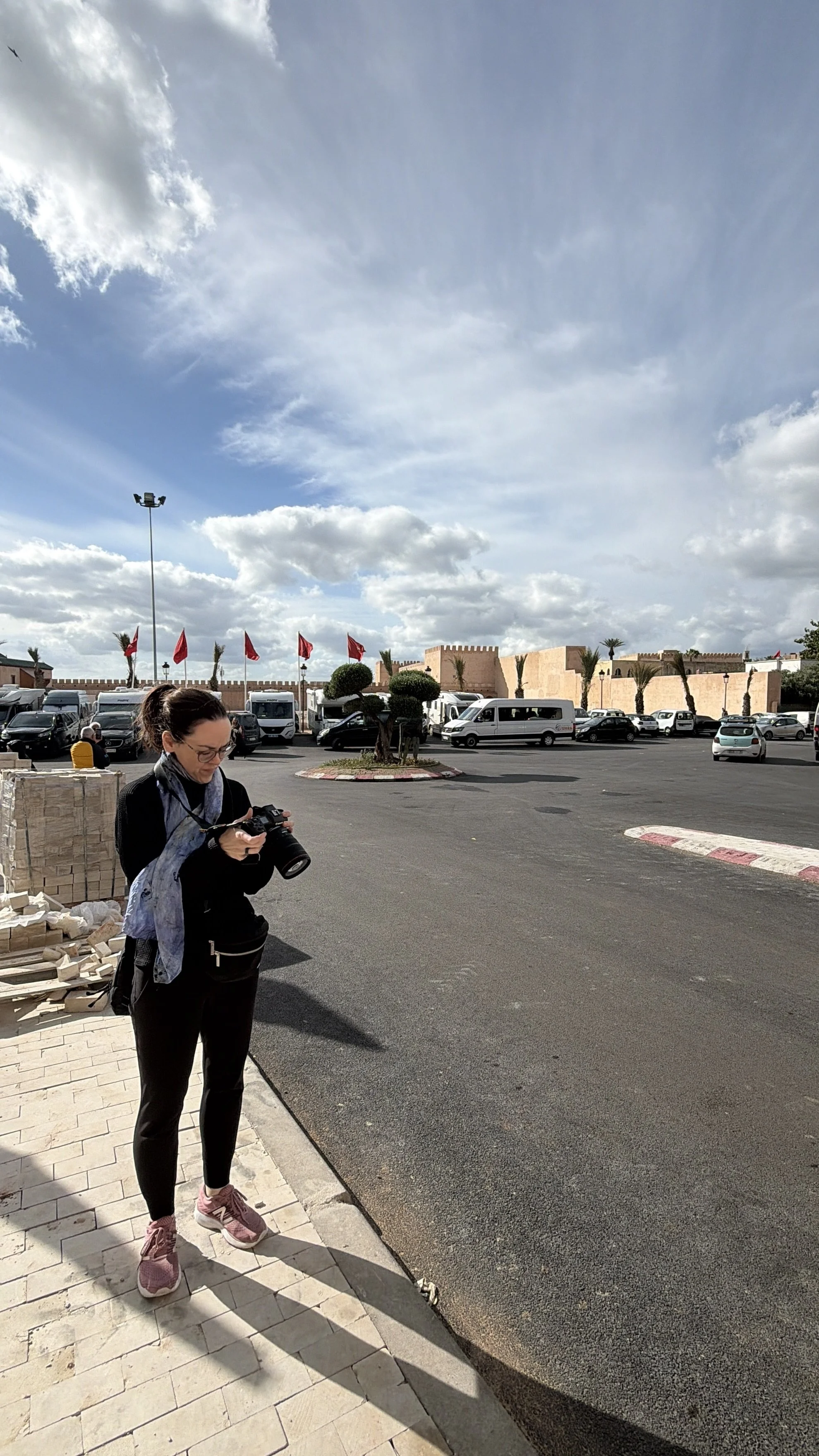 Photo of Kelly looking at her camera