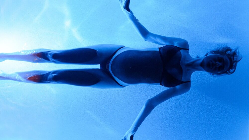 Try the traditional laying on your back with arms at your side