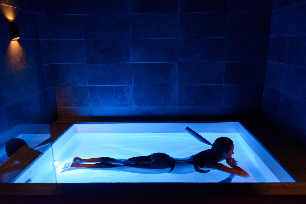 Try your arms crossed up your chin laying on your stomach with or without a pool noodle