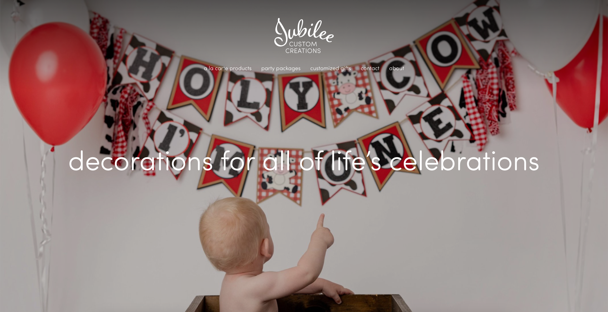 Jubilee Custom Creations website, featuring birthday party decorations with red and white balloons, a banner reading 'HAPPY BIRTHDAY' with cow-themed design, and a young child pointing at the banner.