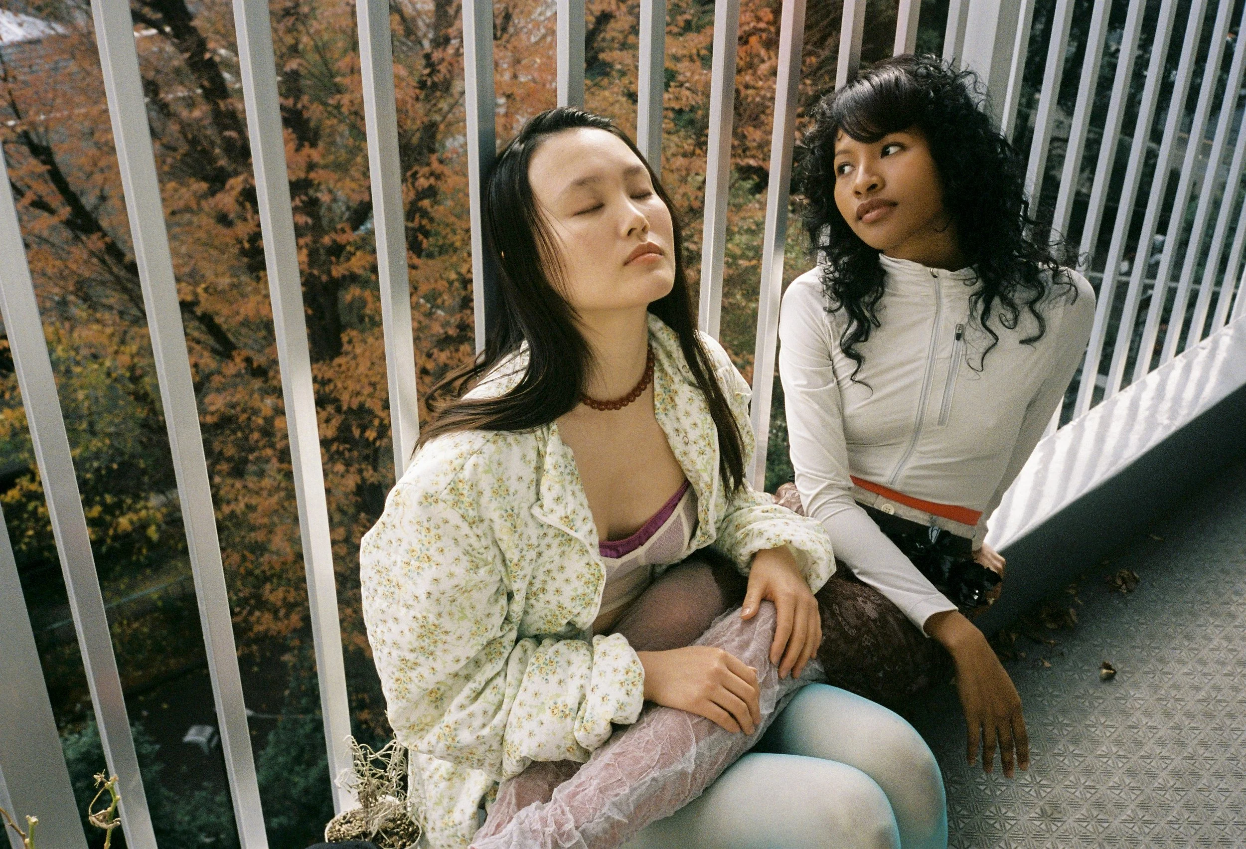 CHIHIRO wears Jacket Mikiosakabe, Necklace and Bustier Nohra, Skirt Pillings (Little League Inc.),  Bra, Stockings and Shoes Stylist’s own.
MAYA wears Jumpsuit and Skirts Fumika_Uchida (Cliff co.,ltd.), Pants Pillings(Little League Inc.), Stockings a