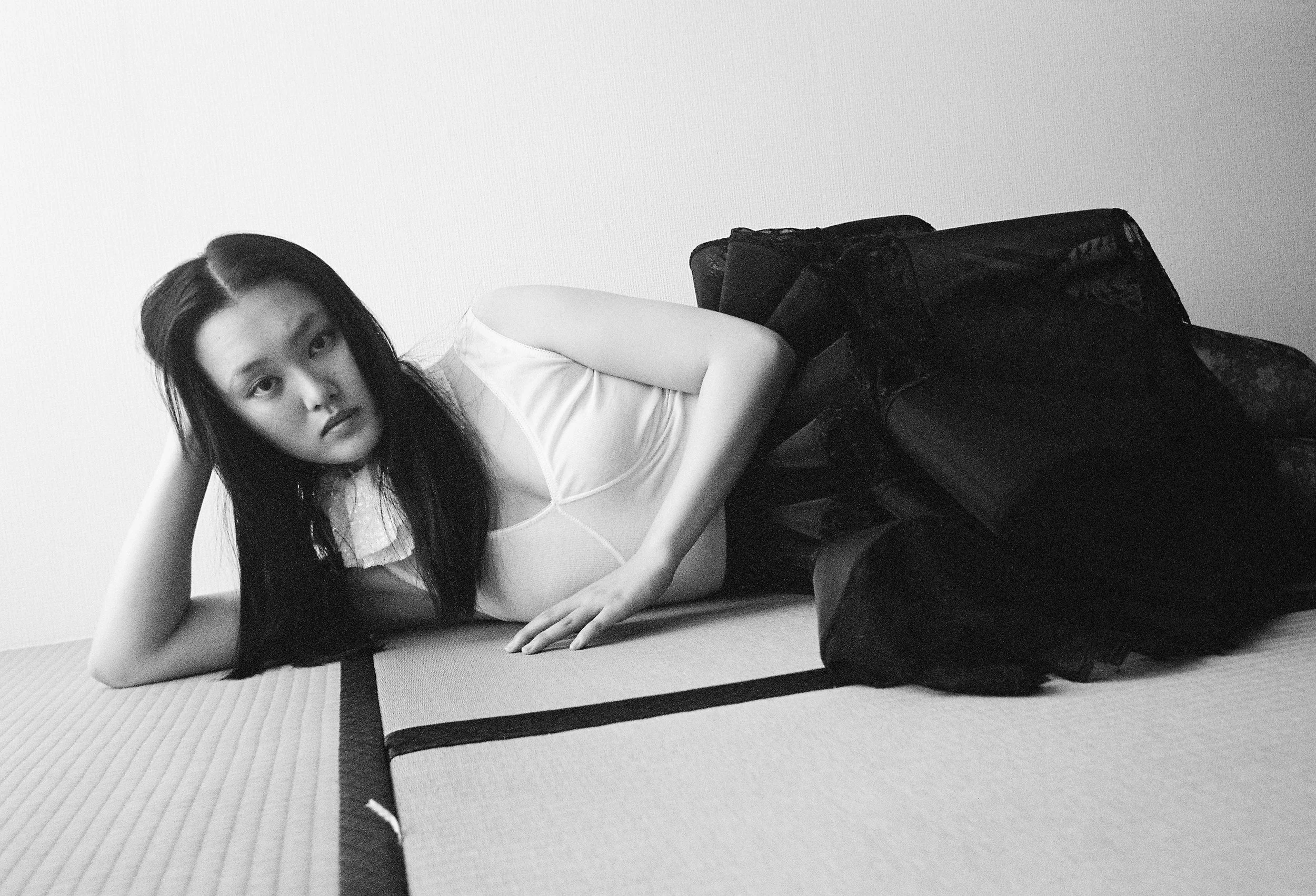 CHIHIRO wears Jumpsuit and Detachable Collar Nohra, Skirt Jun.y, Stockings Stylist’s own. 