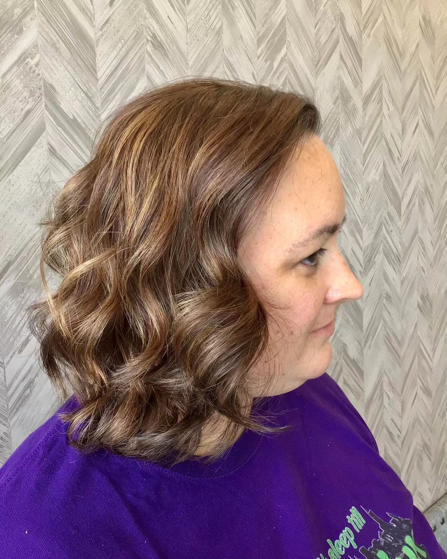 Danielle was tired of years of being red and doing her color at home. So, to help embrace her natural color and help with gray blending, we neutralized the red and popped in some highlights. With a good chop and some curls, she's definitely refreshed