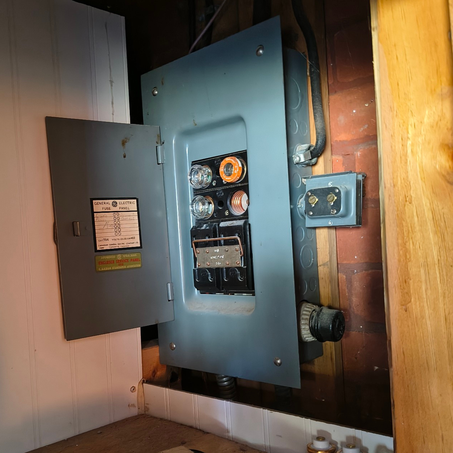 Old residential fuse panel in need of upgrade — Brockville home electrical inspection by Eldridge Electric