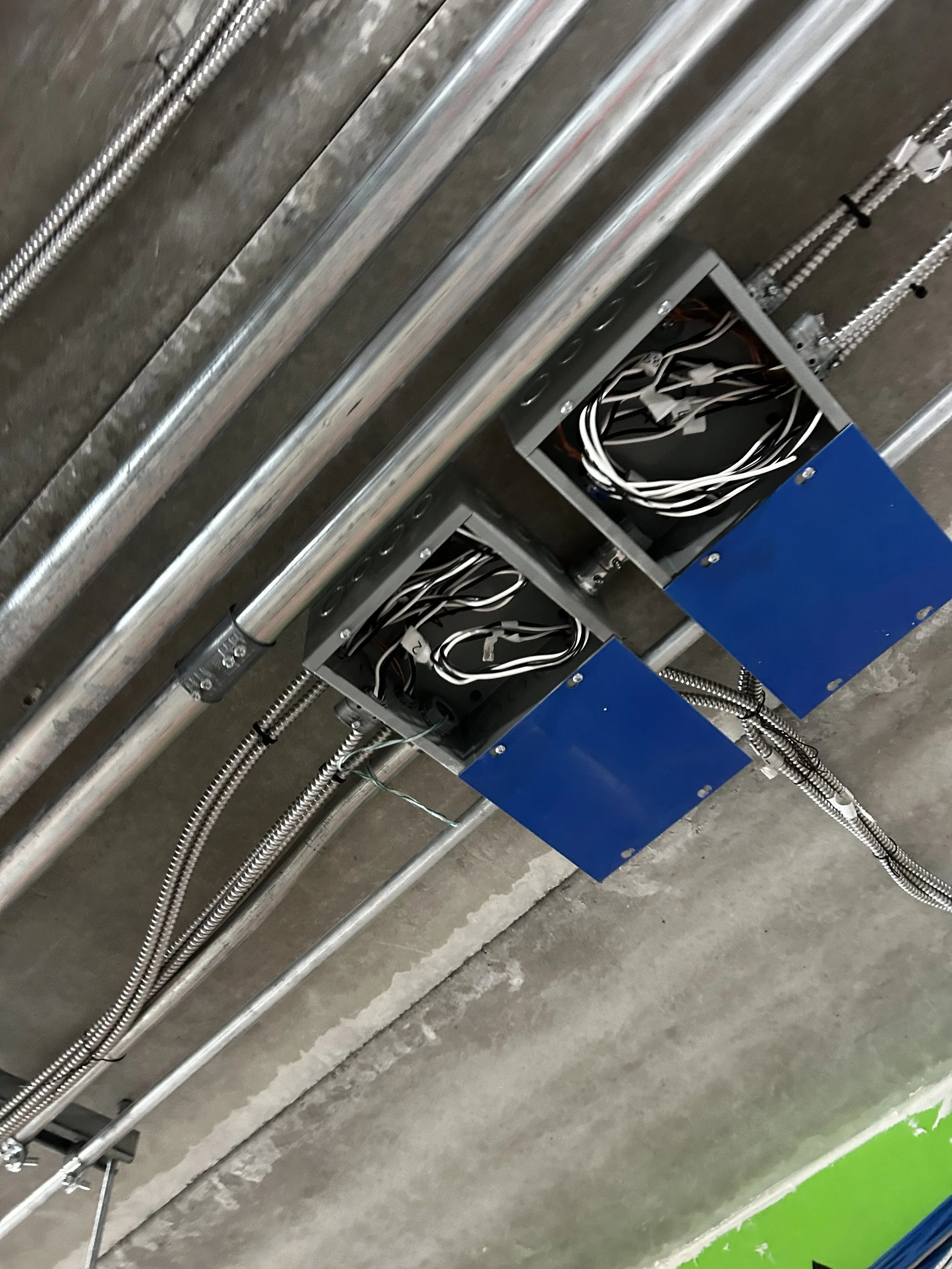 Commercial electrical conduit runs and junction box installations on a large construction project in Ontario