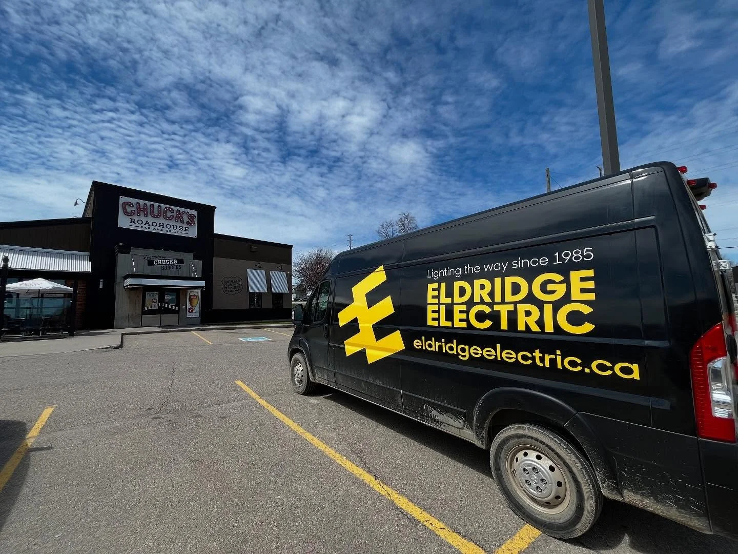 Eldridge Electric service van at commercial electrical project site in Brockville Ontario