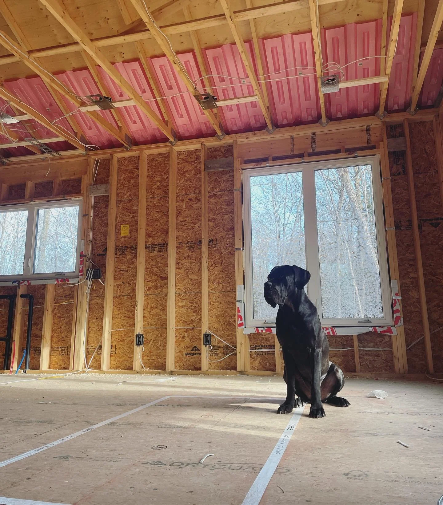 Residential electrical rough-in wiring installation inside a new home under construction