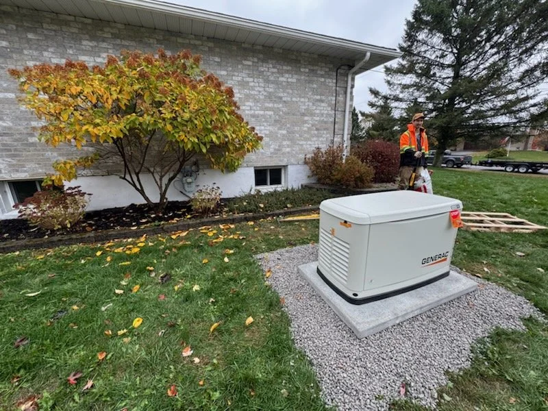 Generac standby generator installed on concrete pad beside a home by Eldridge Electric in Brockville Ontario