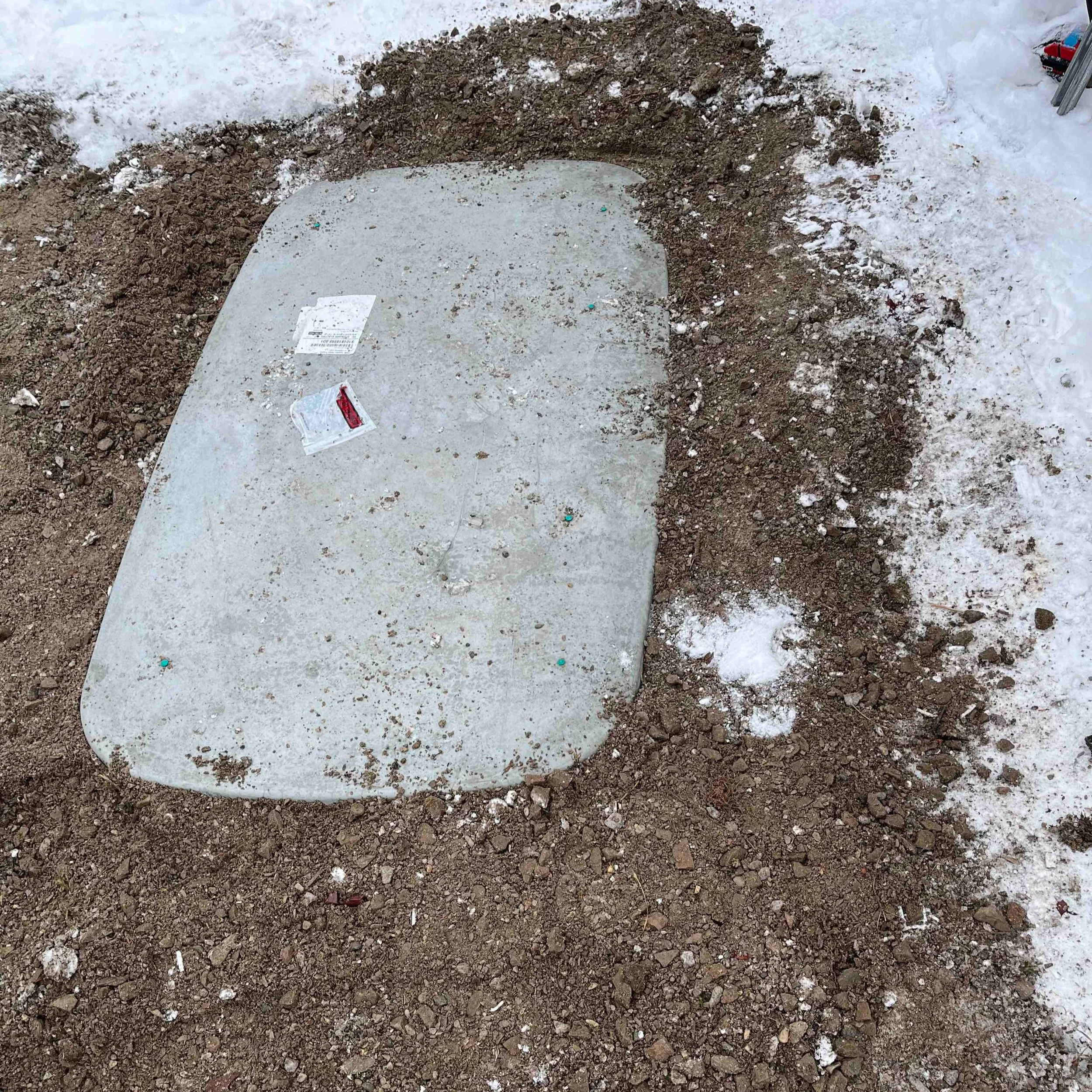 Freshly installed concrete GenPad on compacted gravel base — part of every Eldridge Electric generator installation in Ontario
