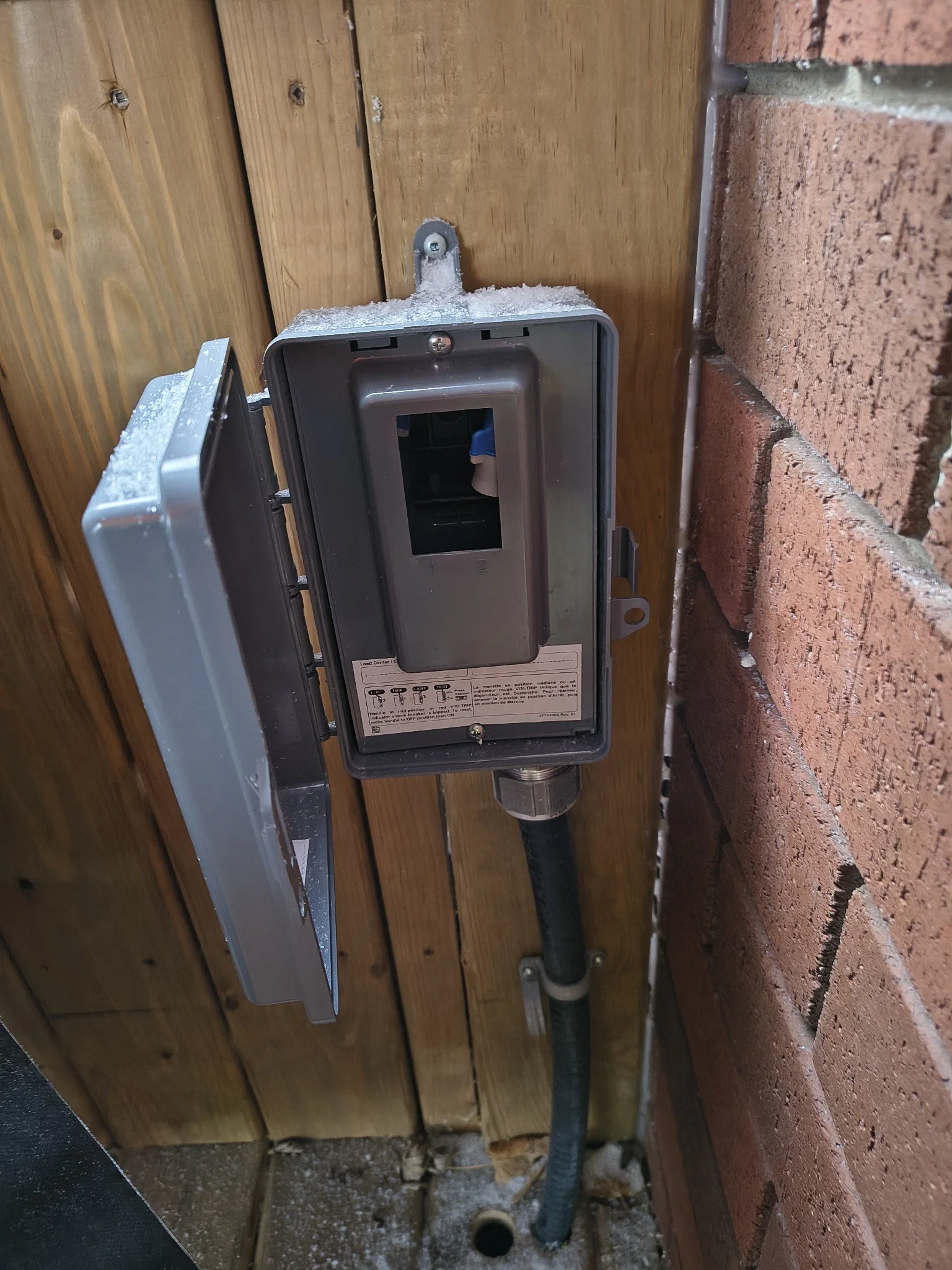 Weatherproof disconnect panel installed for hot tub electrical connection by licensed electricians in Ontario