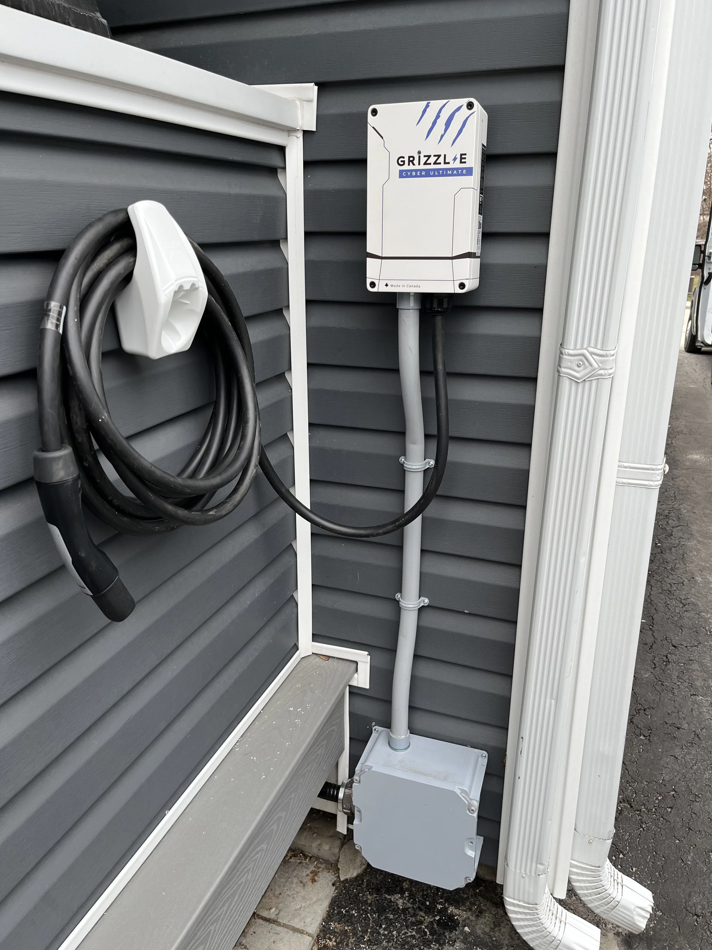 Grizzl-E Level 2 EV charger installed on exterior of home by licensed electricians in Ontario
