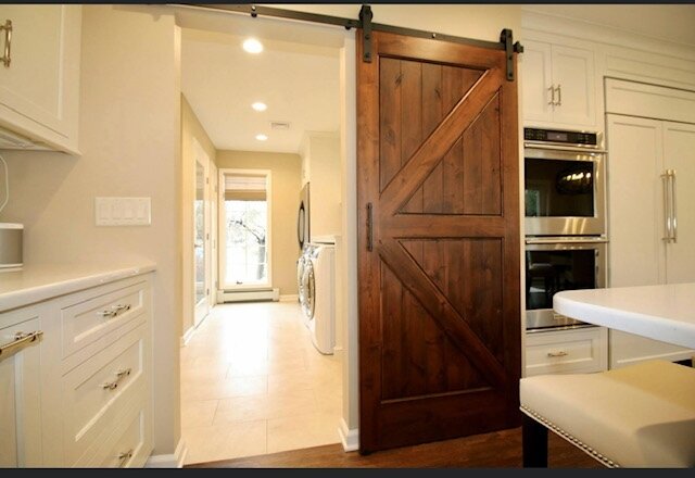 Amazing barn door separating the kitchen and mudroom spaces⁠
⁠
.⁠
.⁠
.⁠
.⁠
.⁠
#homerenovation #njhomes #njhomerenovation #newjerseyinteriordesign #customhomes #luxuryhome #NJhomedesign #NJhomedecor #customhomedesign #centraljersey #decor #homedecor #