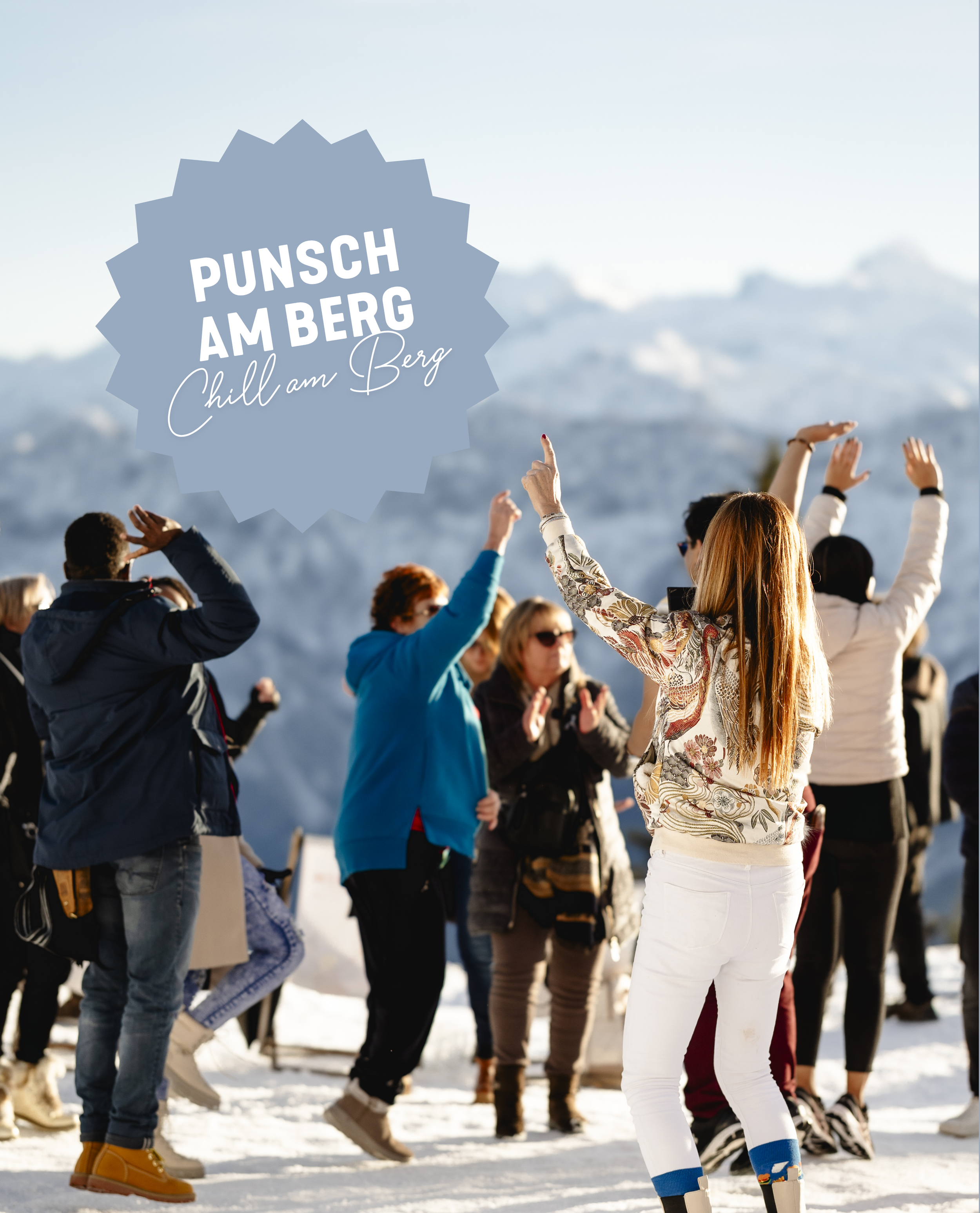 People dancing in front of the Dachstein massif
