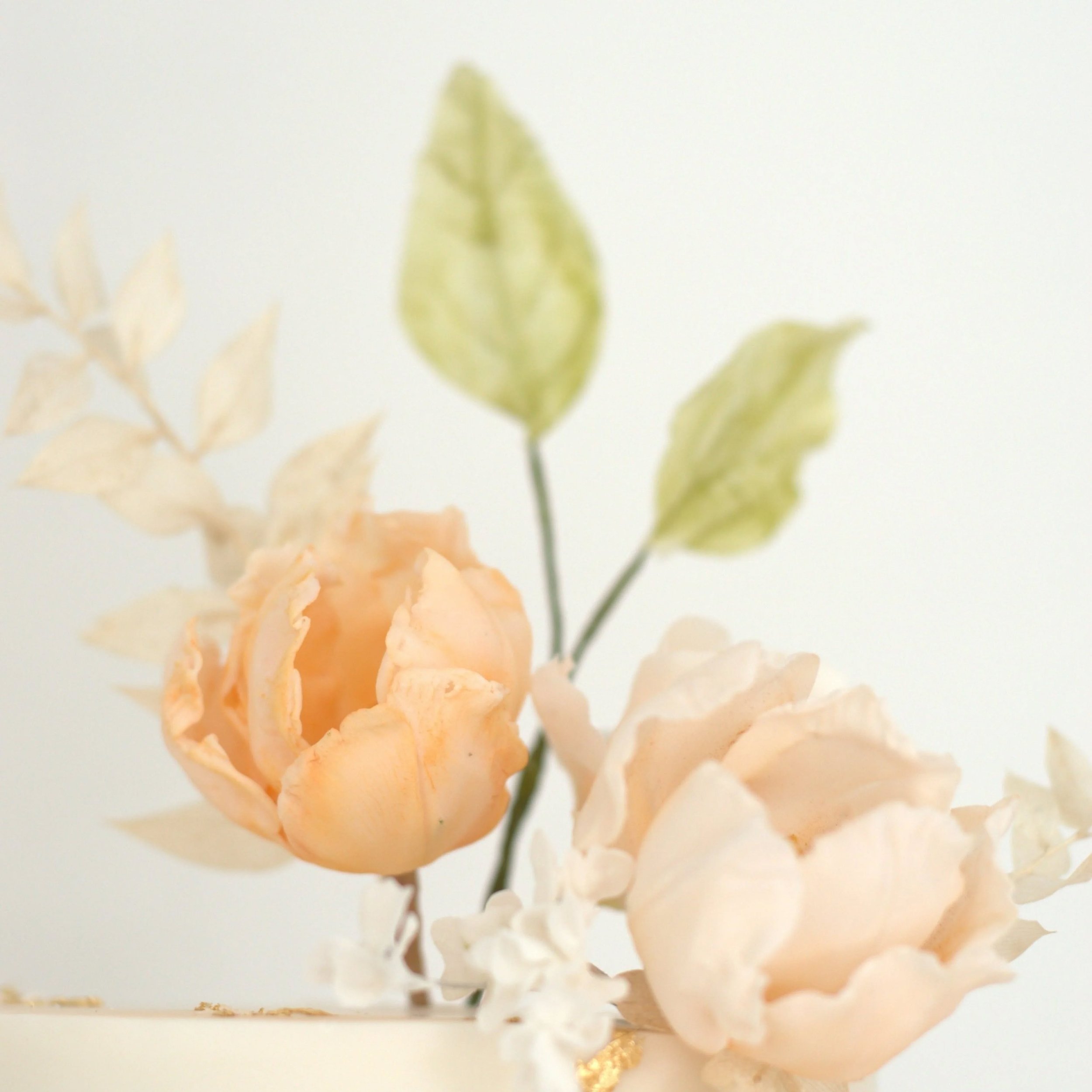 Soft peaches and classic creams - one of the most romantic shade combinations and definitely a favourite of mine - so what an absolute dream it was to create this beautiful cascade of sugar tulips and roses for Esther &amp; Neil&rsquo;s cake, and the