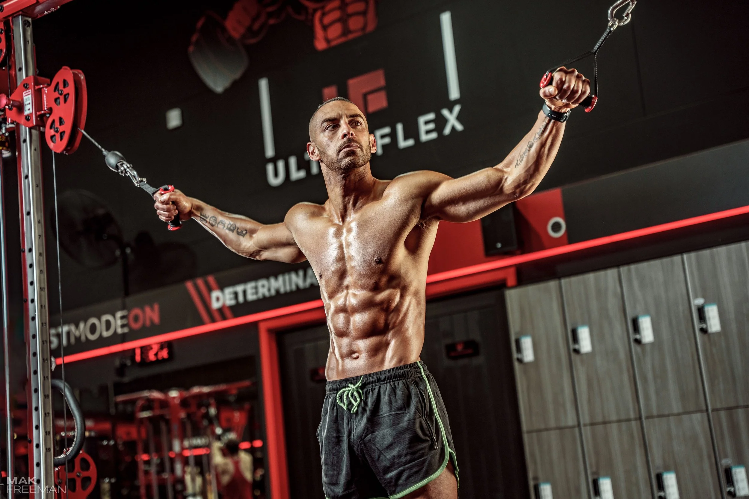 male fitness photoshoot holding  crossover
