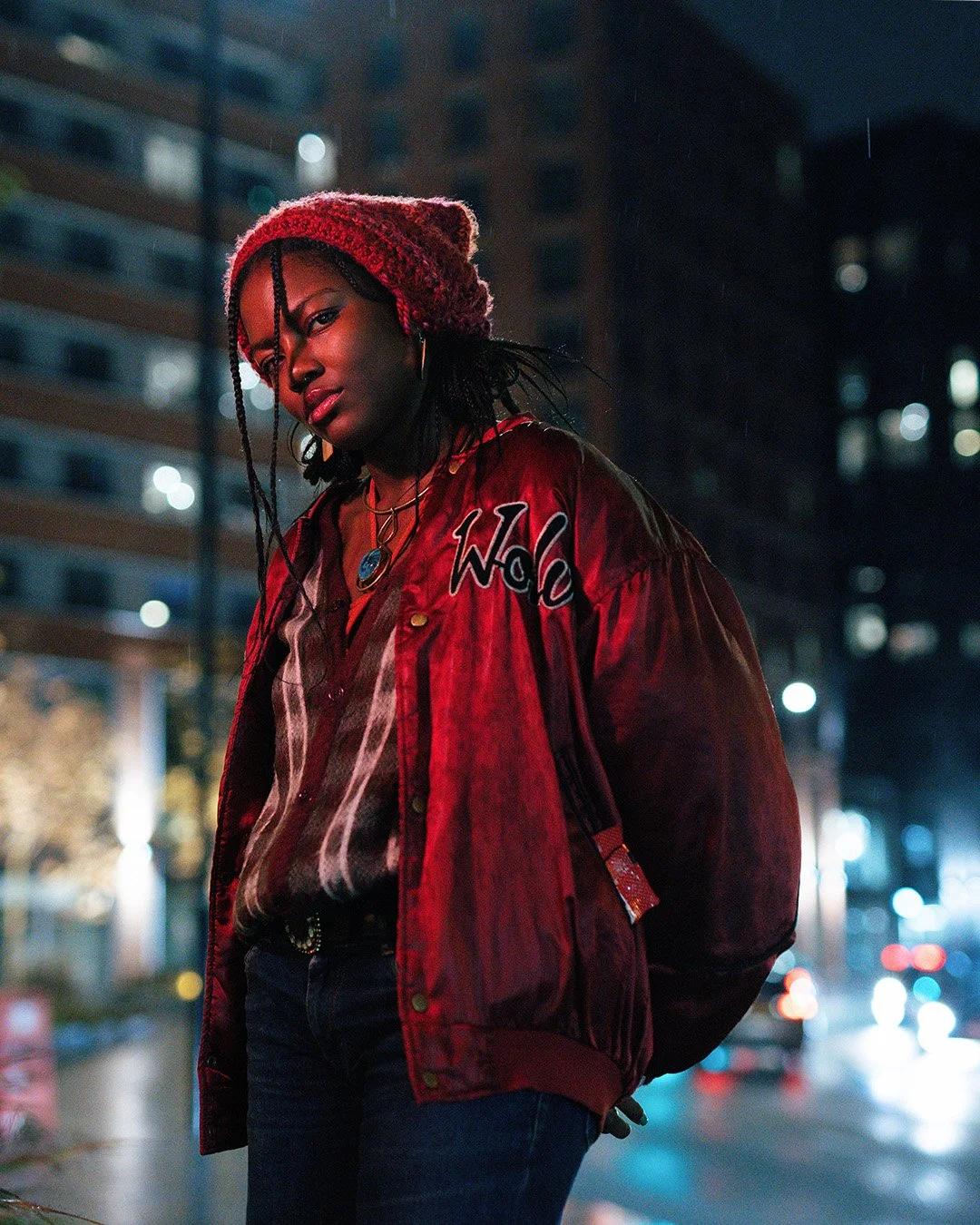 photo of musician Atlantis Dubois in an urban setting by Oscar May Photography
